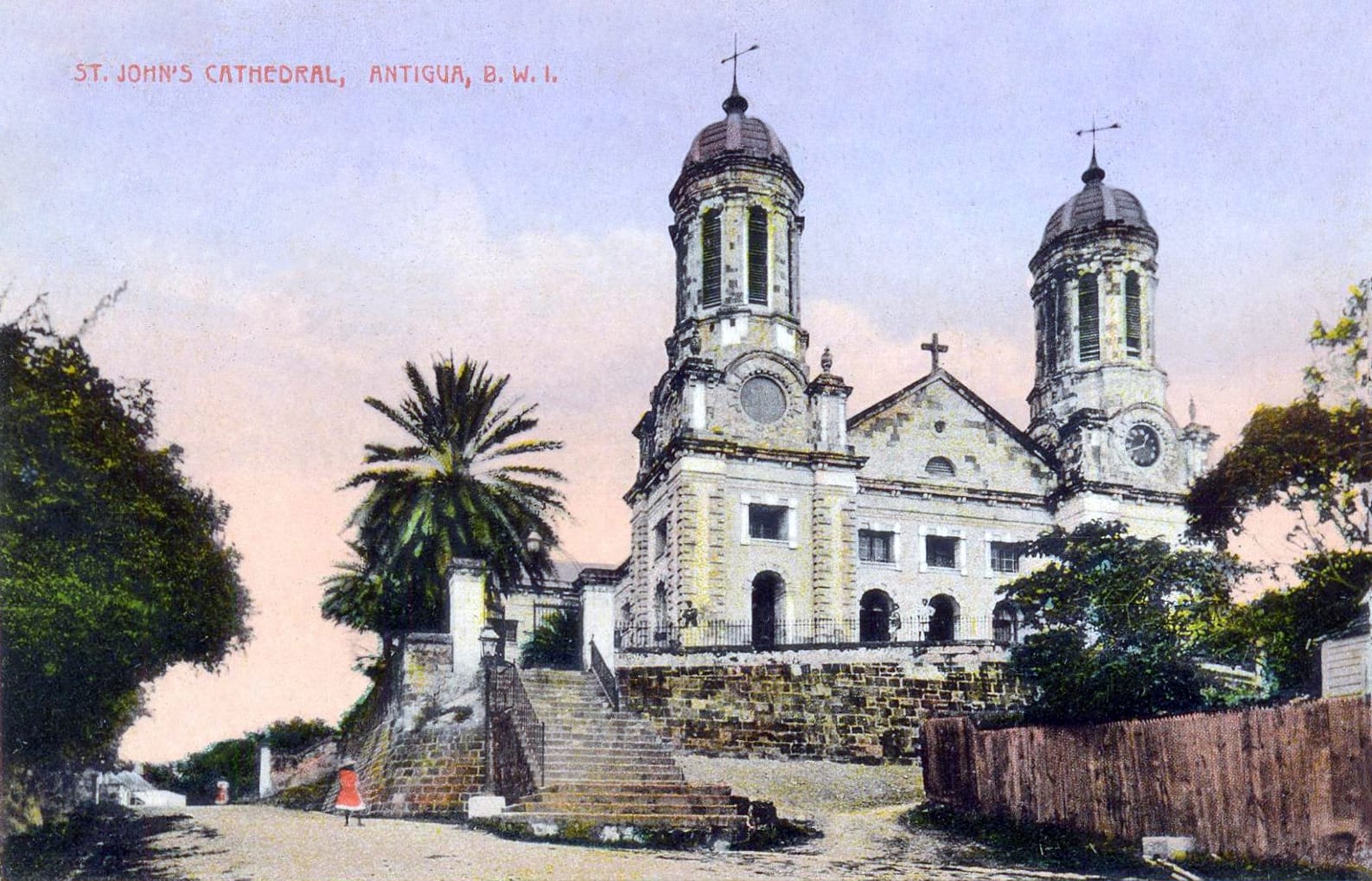 An early 20th-century photograph of a large twin-towered stone cathedral above a low town