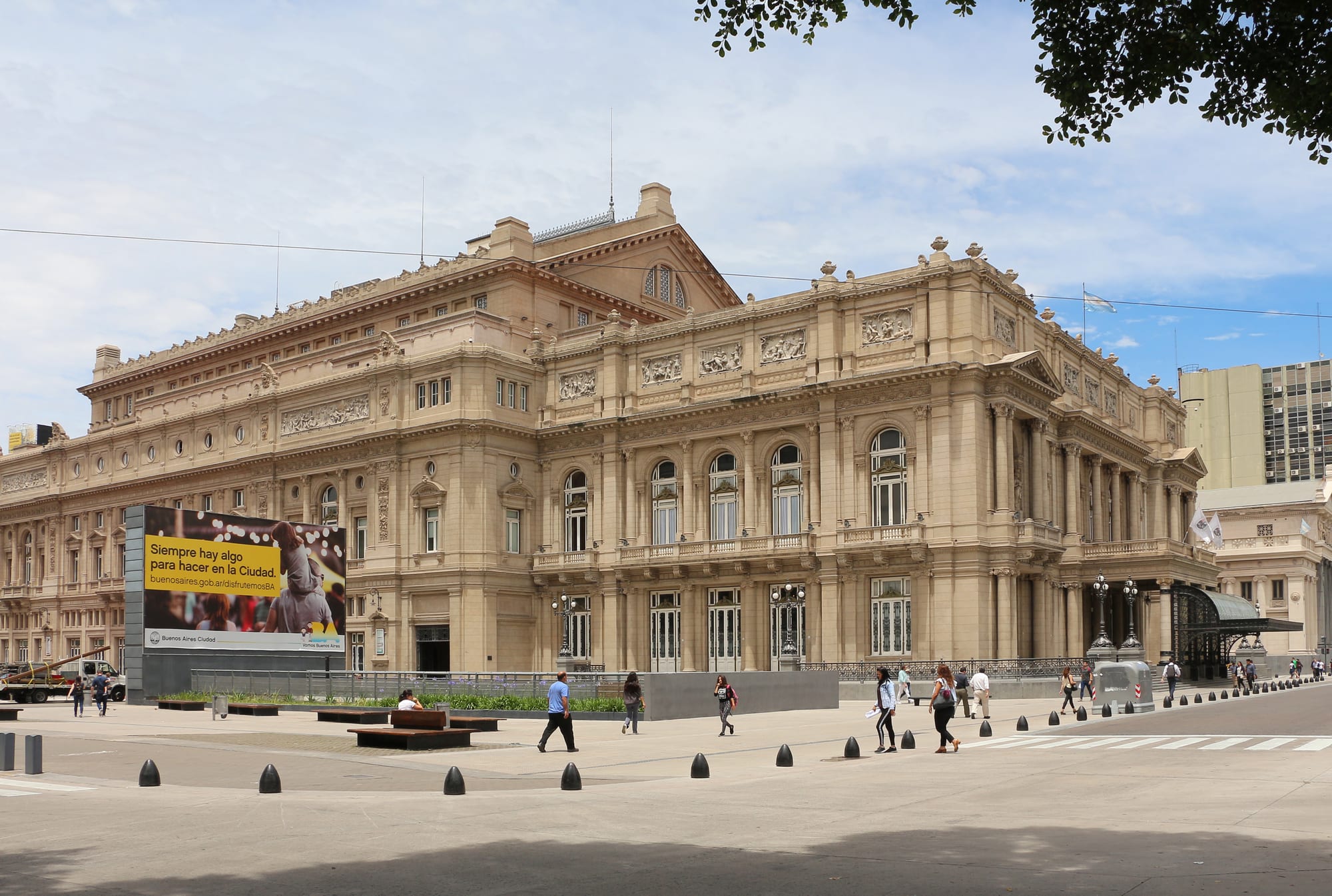The grand columned façade of a large 19th-century opera house