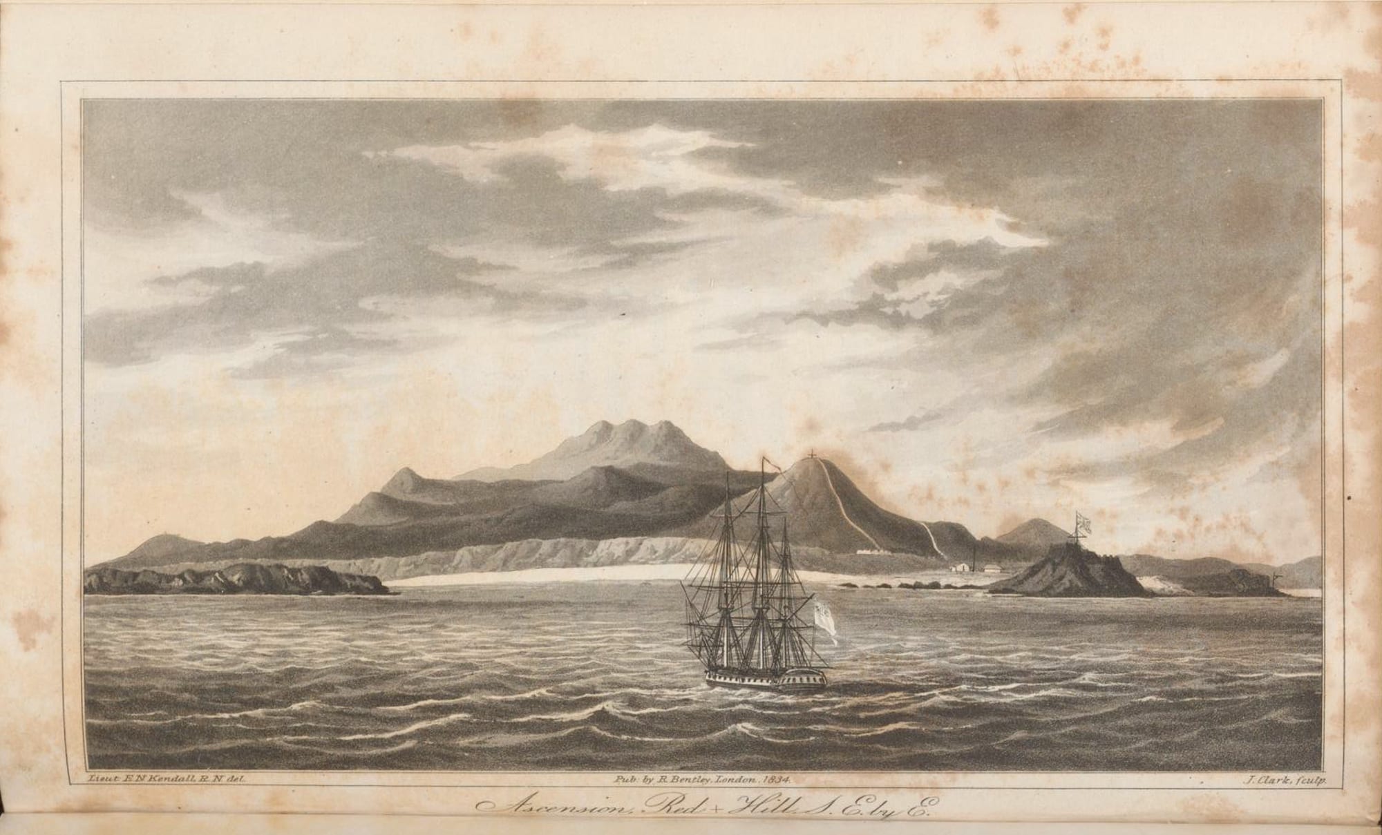 A sepia engraving of a bare volcanic island of cones and ridges seen from the sea, with a three-masted sailing warship offshore and a flag flying on a small hill by the shore