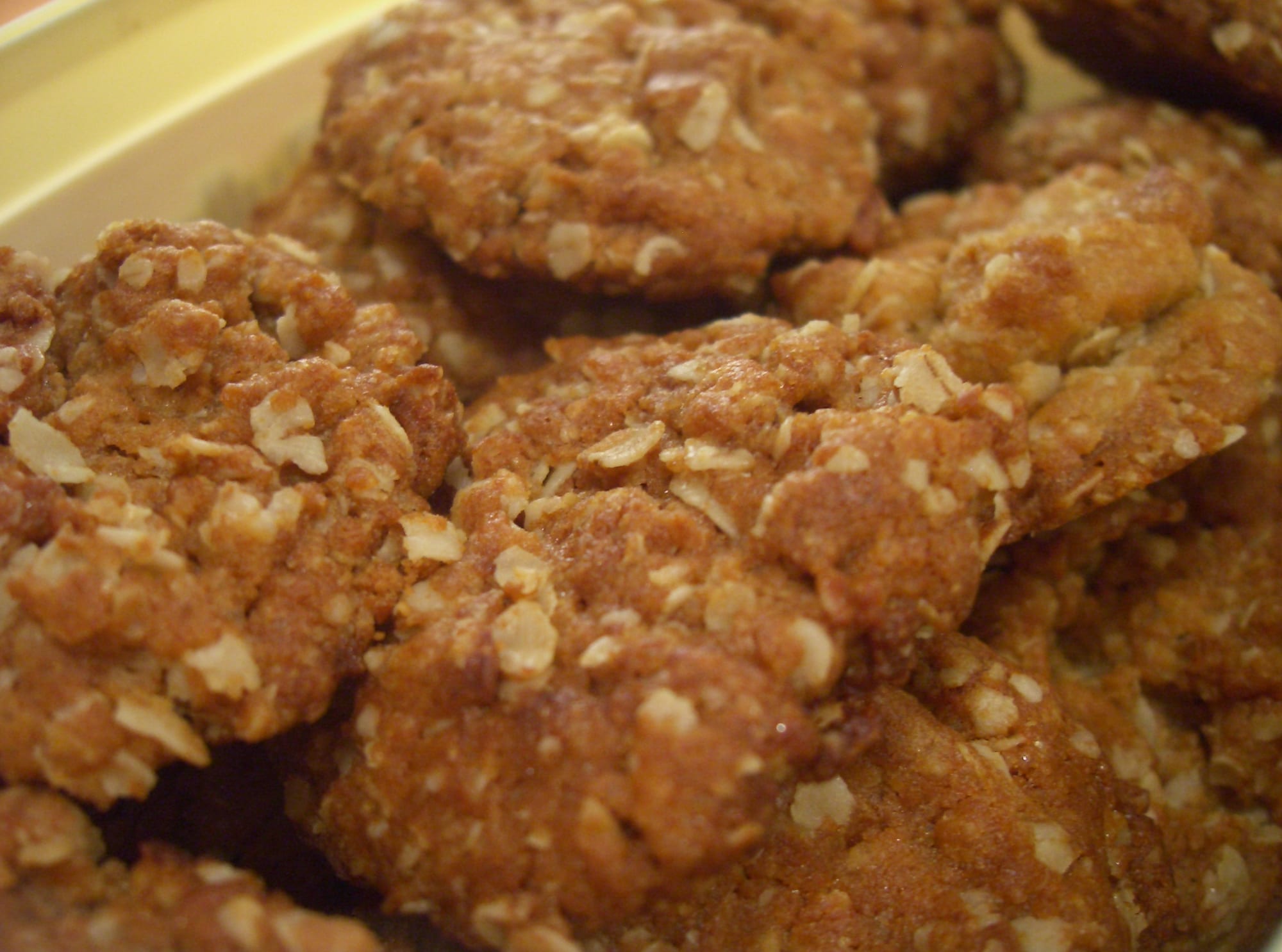 A pile of golden-brown oat biscuits