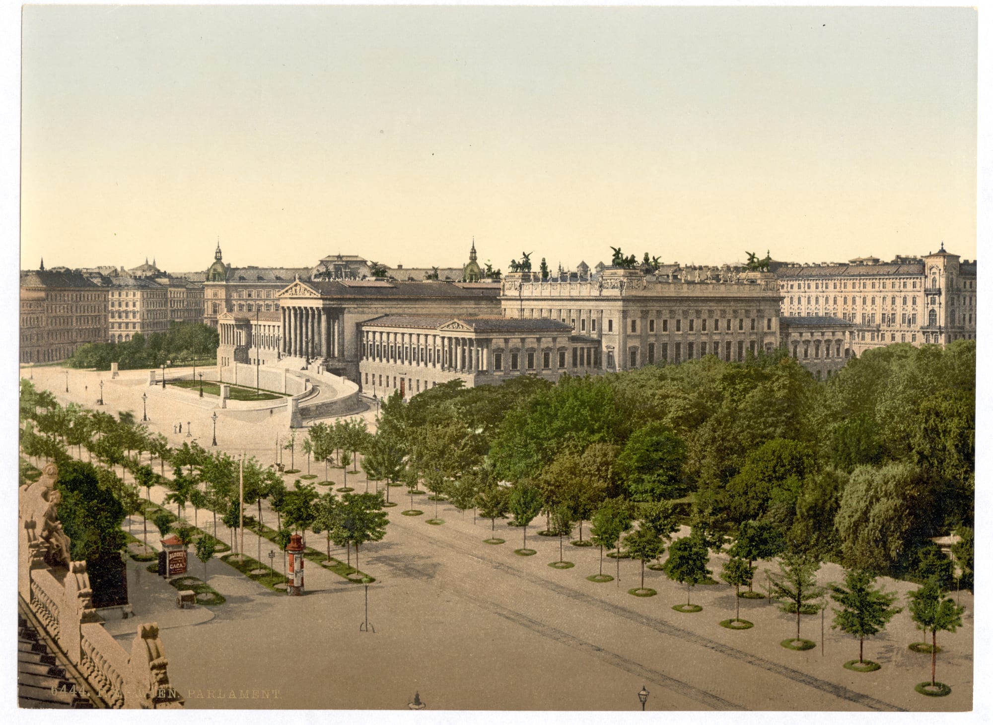 A grand neoclassical parliament building with a Greek temple front and colonnades, on a wide boulevard