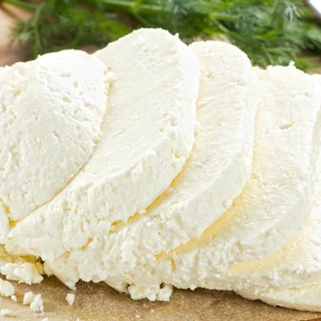 Pale, firm blocks of white cheese