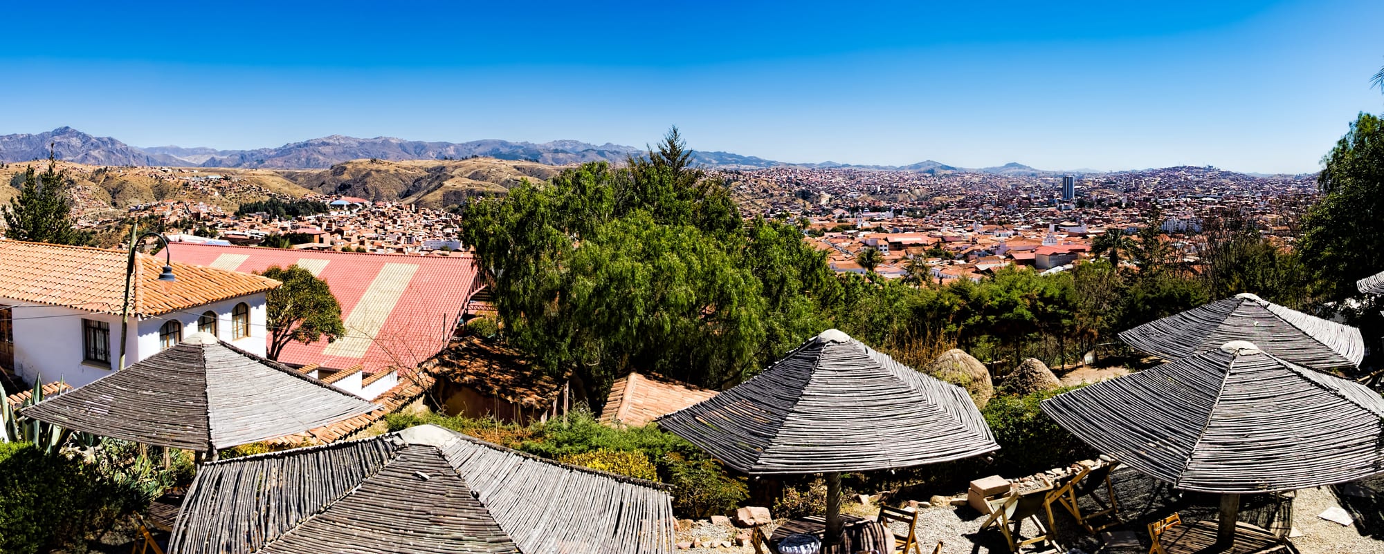 A hillside city of uniformly whitewashed buildings with red roofs and church towers