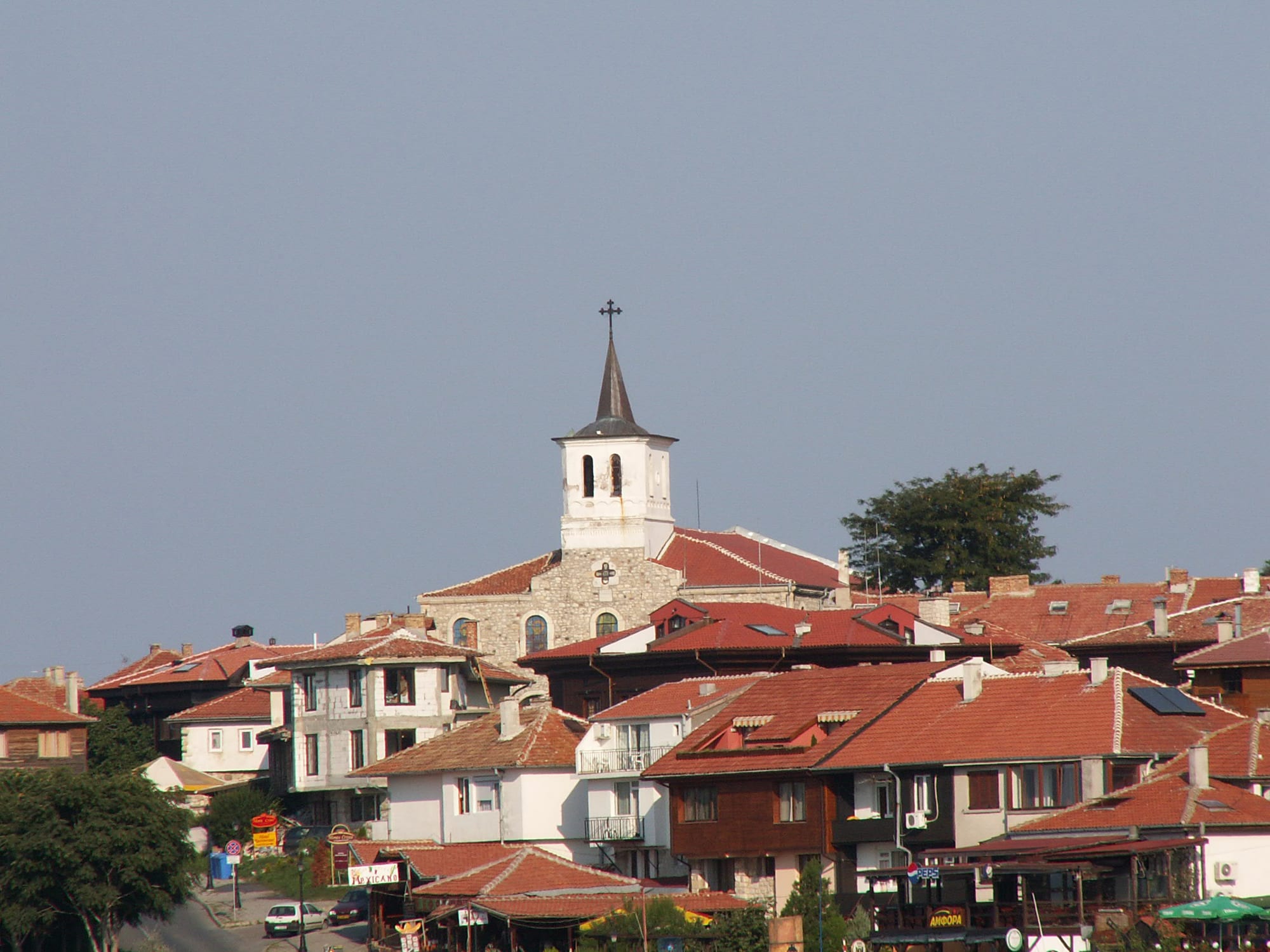 A small stone-and-timber town crowded onto a rocky peninsula joined to the mainland by a causeway