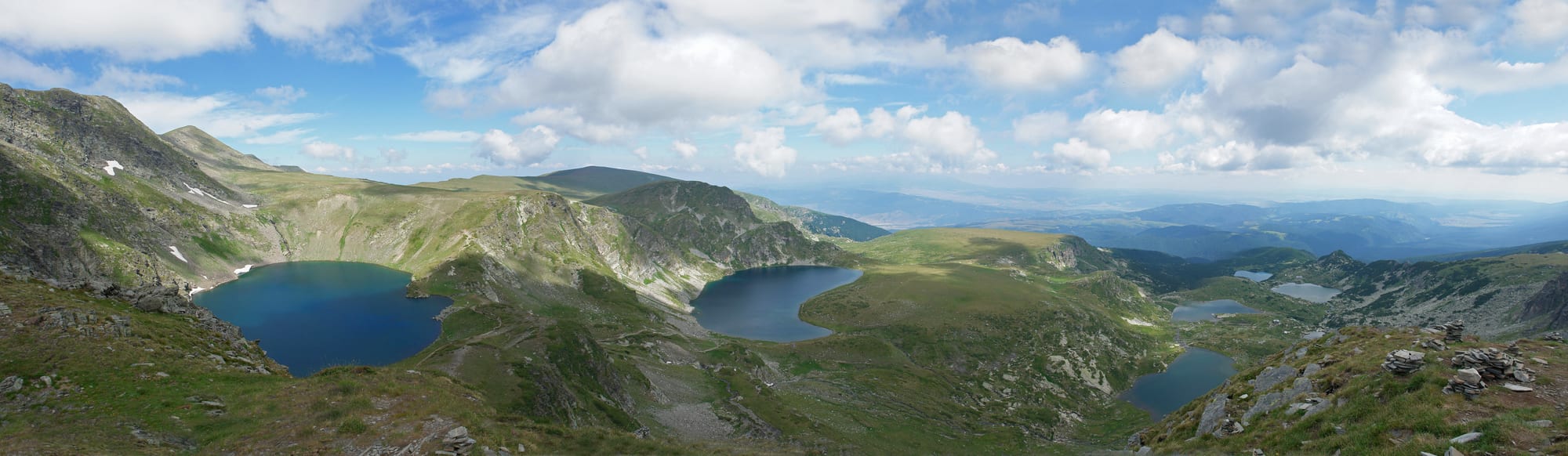 A chain of glacial lakes stepping down a bare high mountain cirque