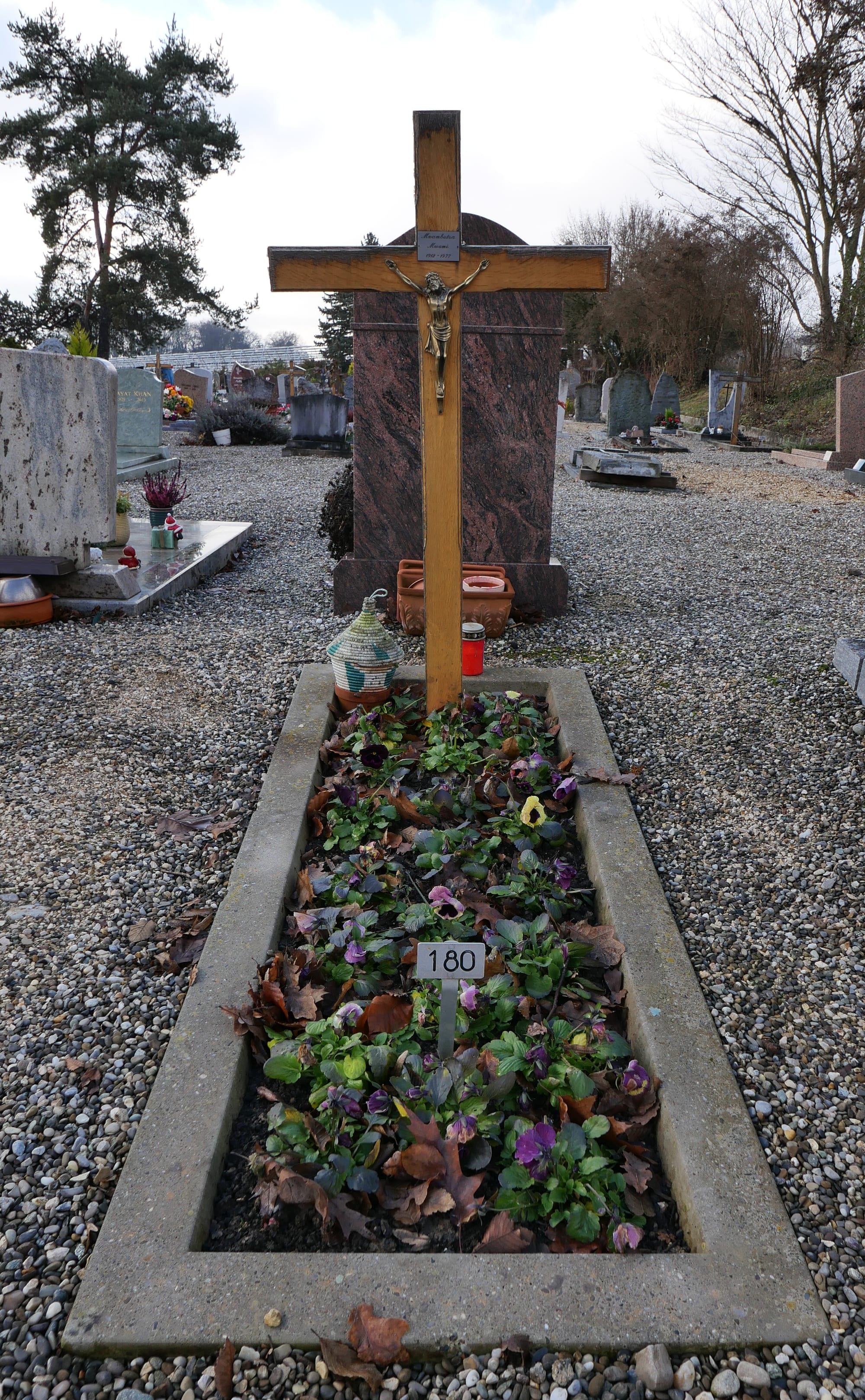 A simple flat grave slab with an inscription in a quiet Swiss cemetery