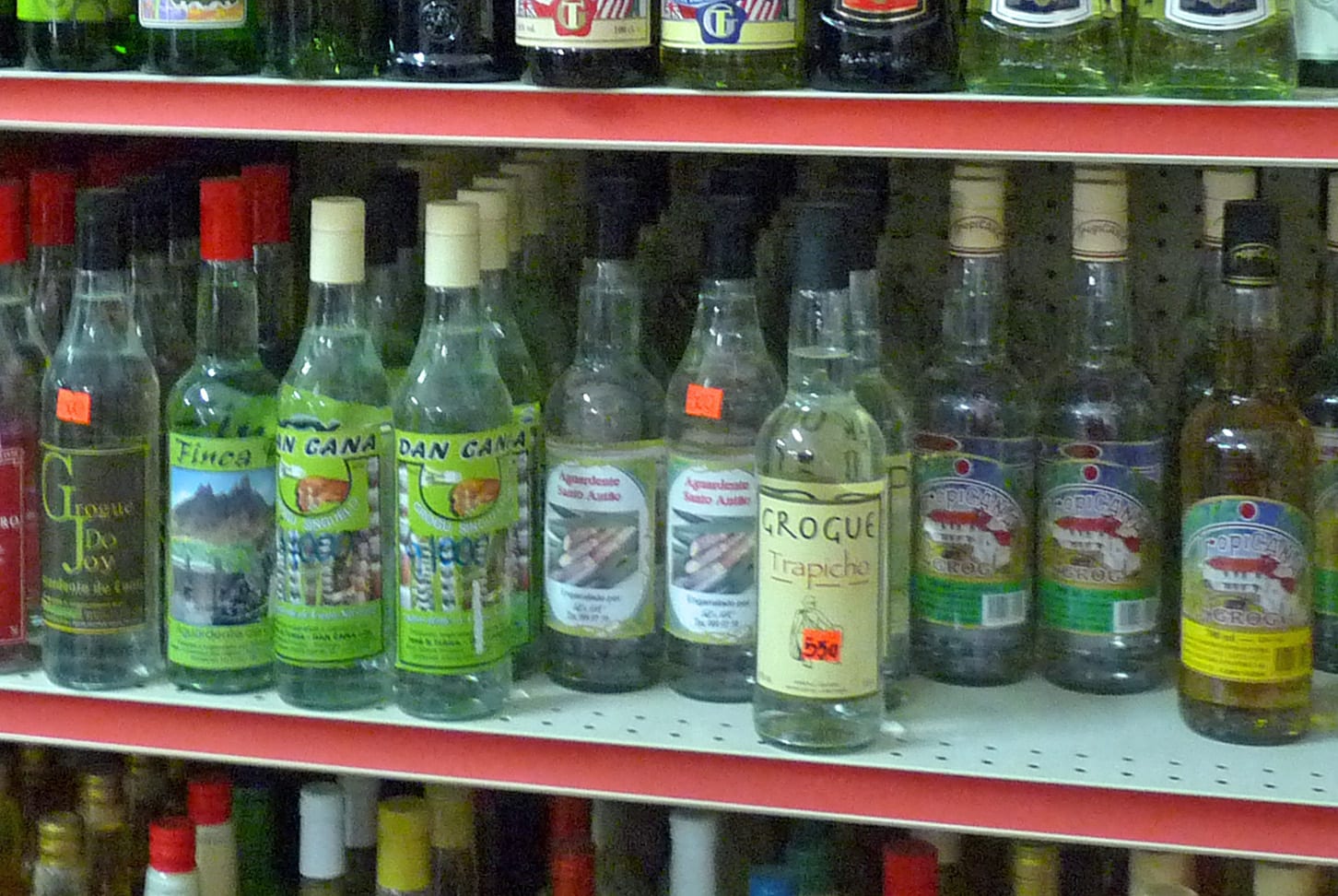 Several bottles of clear and aged spirit labelled as grogue from Cape Verde