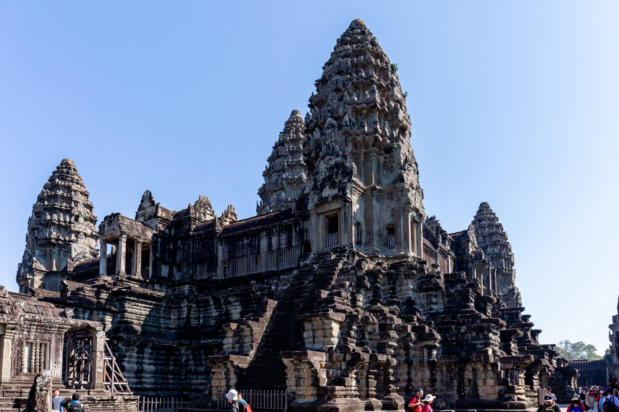 The central tower of Angkor Wat rising against a clear blue sky
