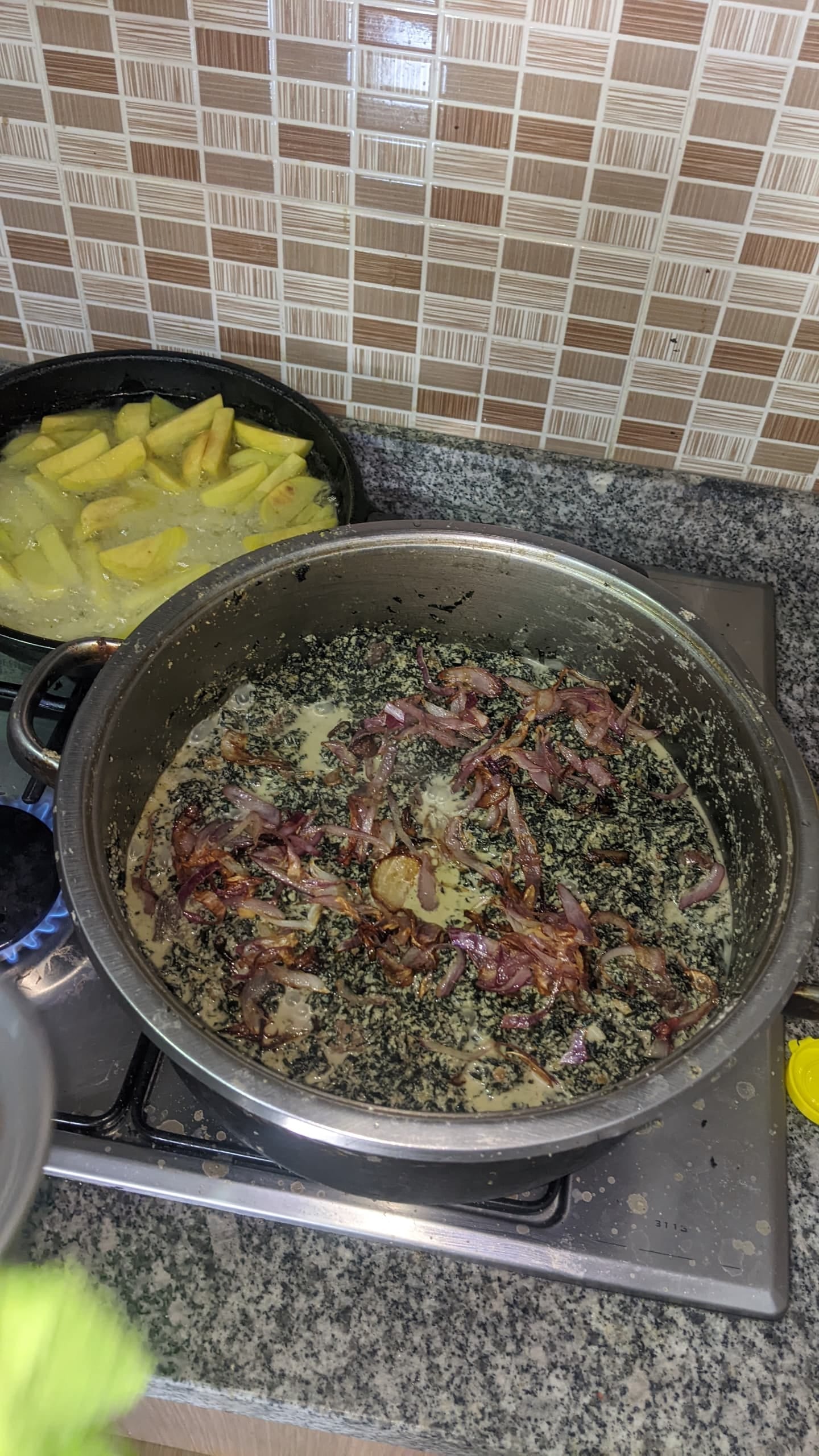 A bowl of dark green, nutty stew