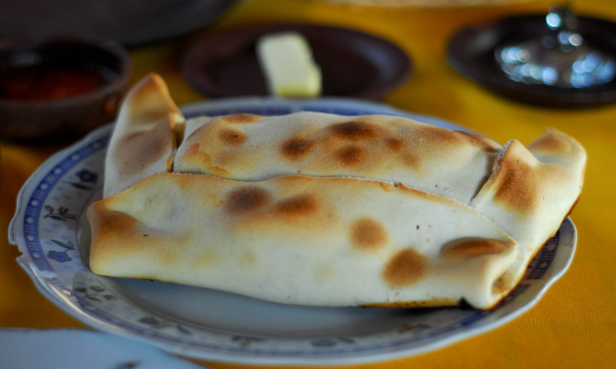 A large golden baked pastry on a plate