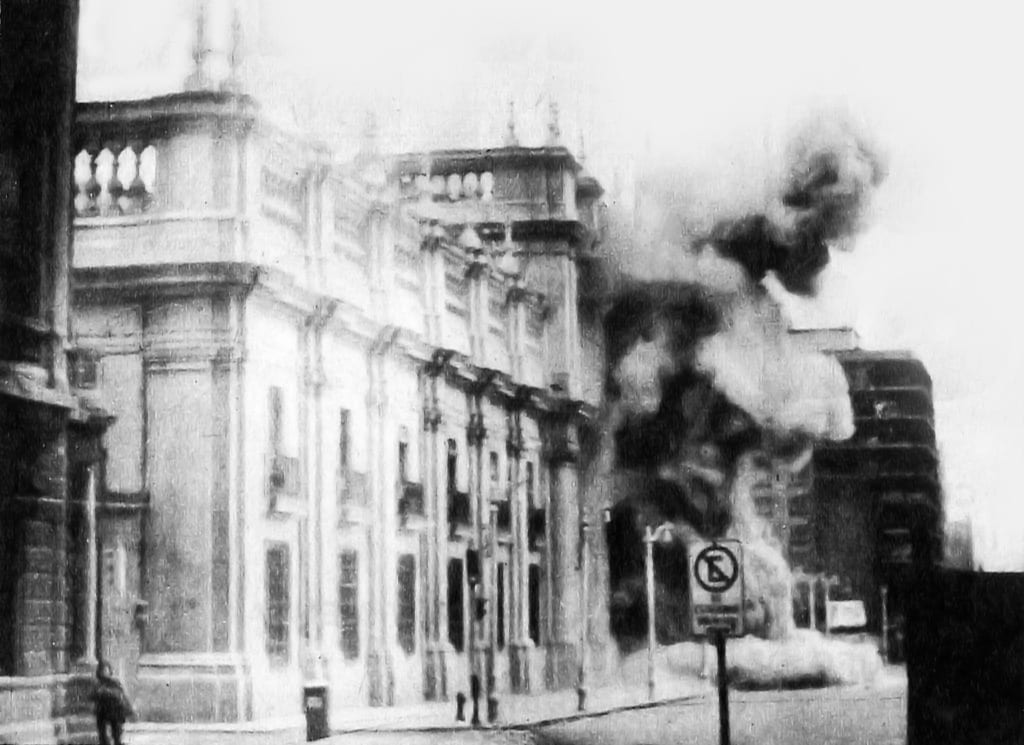 Smoke pouring from the windows of the presidential palace as it is bombed, 11 September 1973
