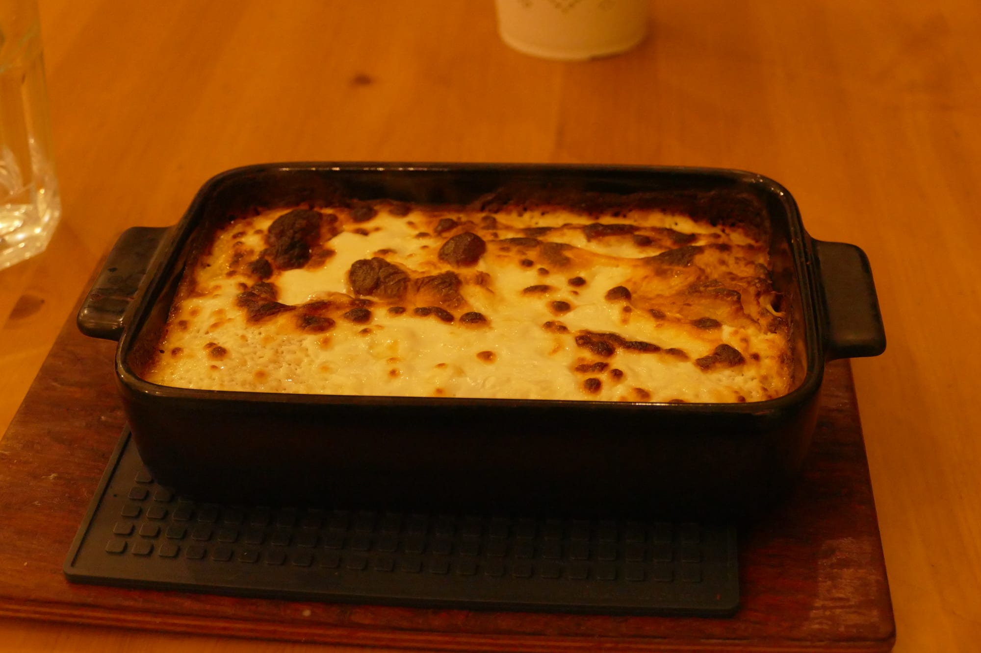 A baked dish of pastry filled with cheese, golden on top