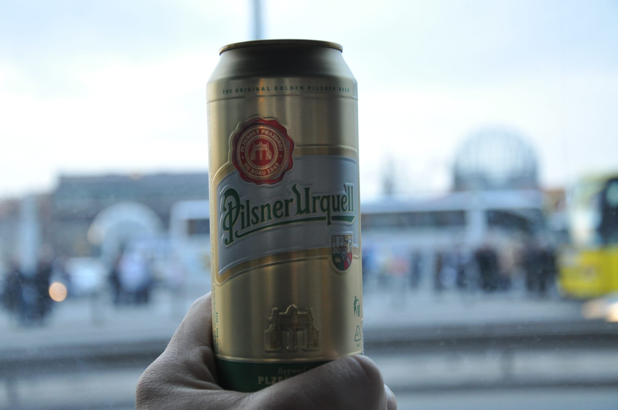 A glass of golden beer with a thick white head