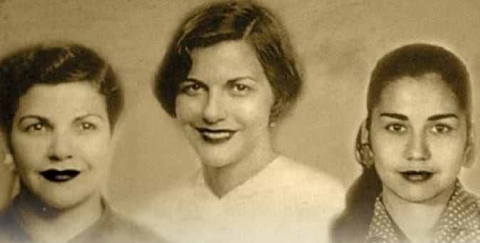 A vintage photograph of three young women, the Mirabal sisters, side by side