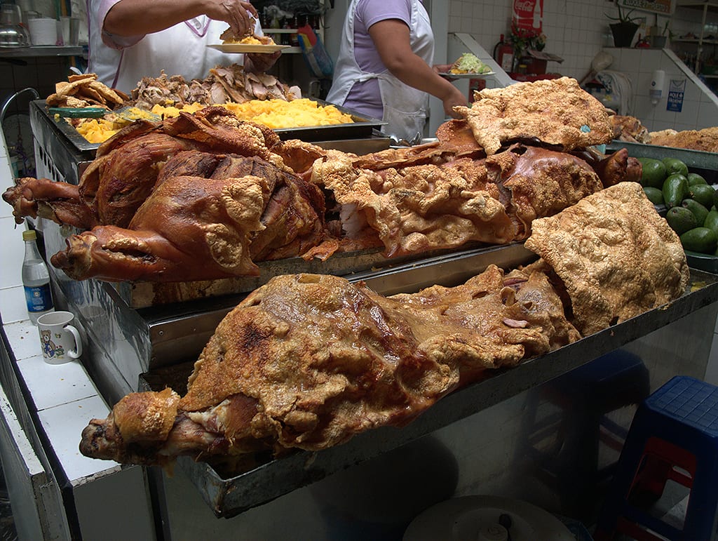 Roasted pork with crackling skin displayed at a market stall