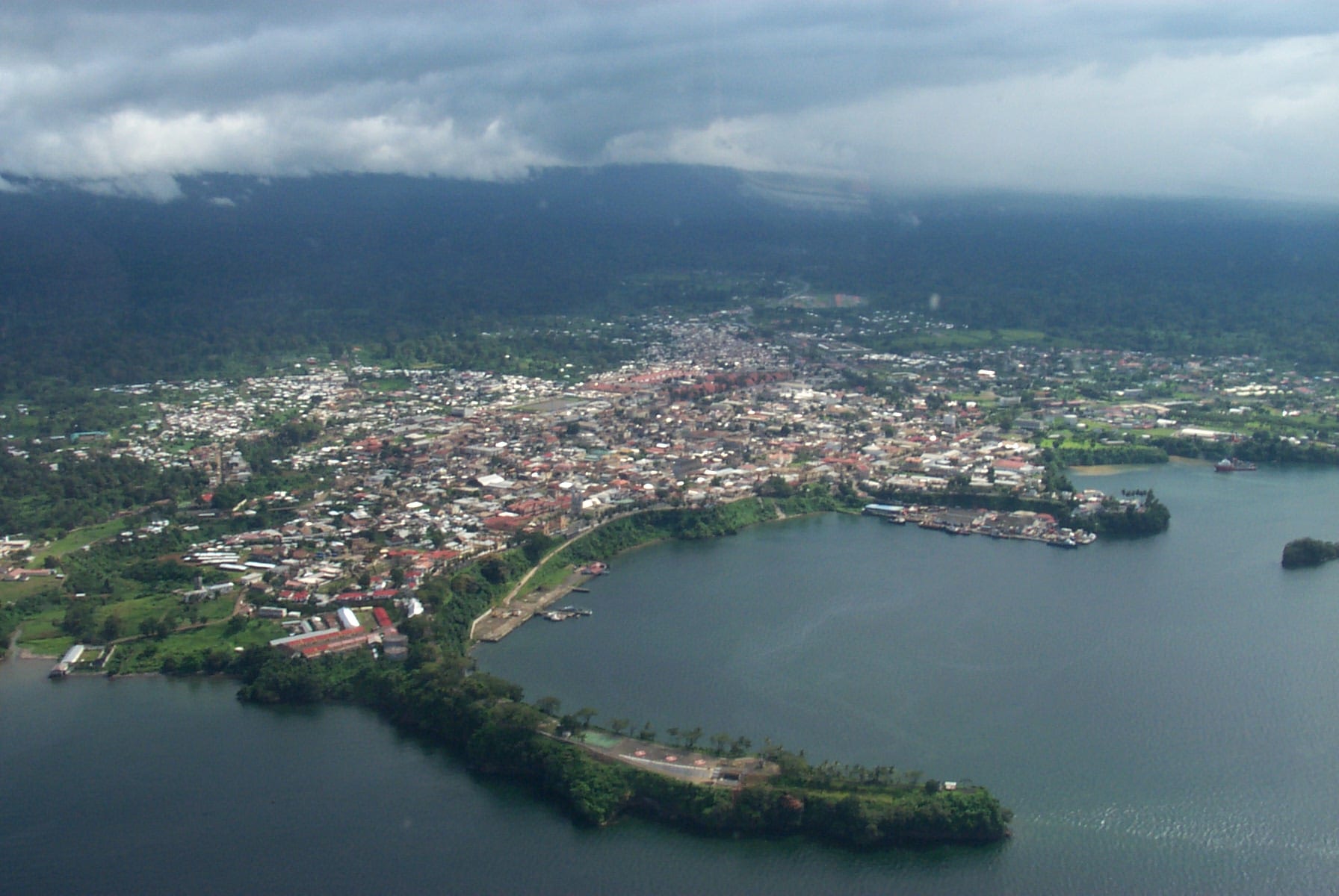 A view over the low-rise rooftops of Malabo toward the sea