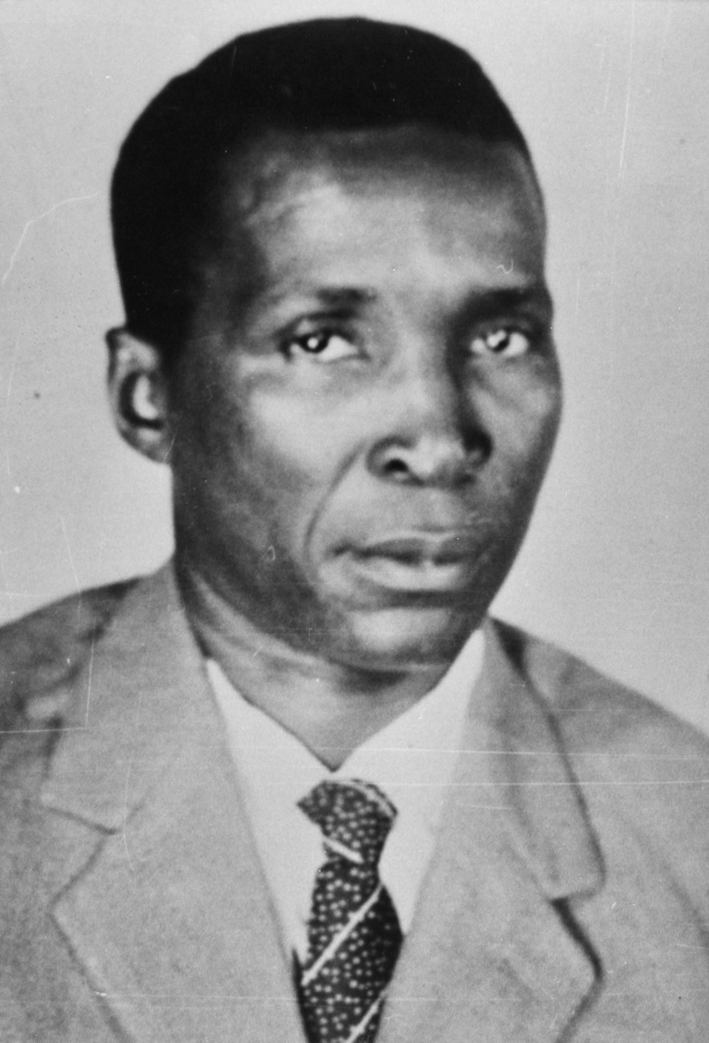 A 1960s press photograph of Francisco Macías Nguema in a suit