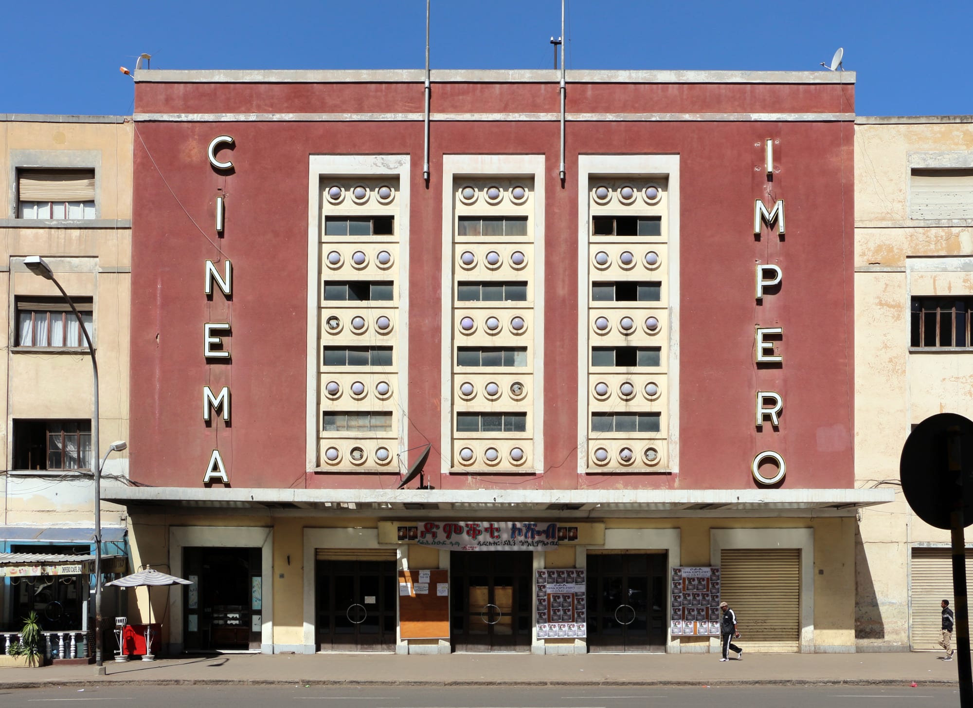 The streamlined 1930s facade of the Cinema Impero in Asmara, with vertical lettering