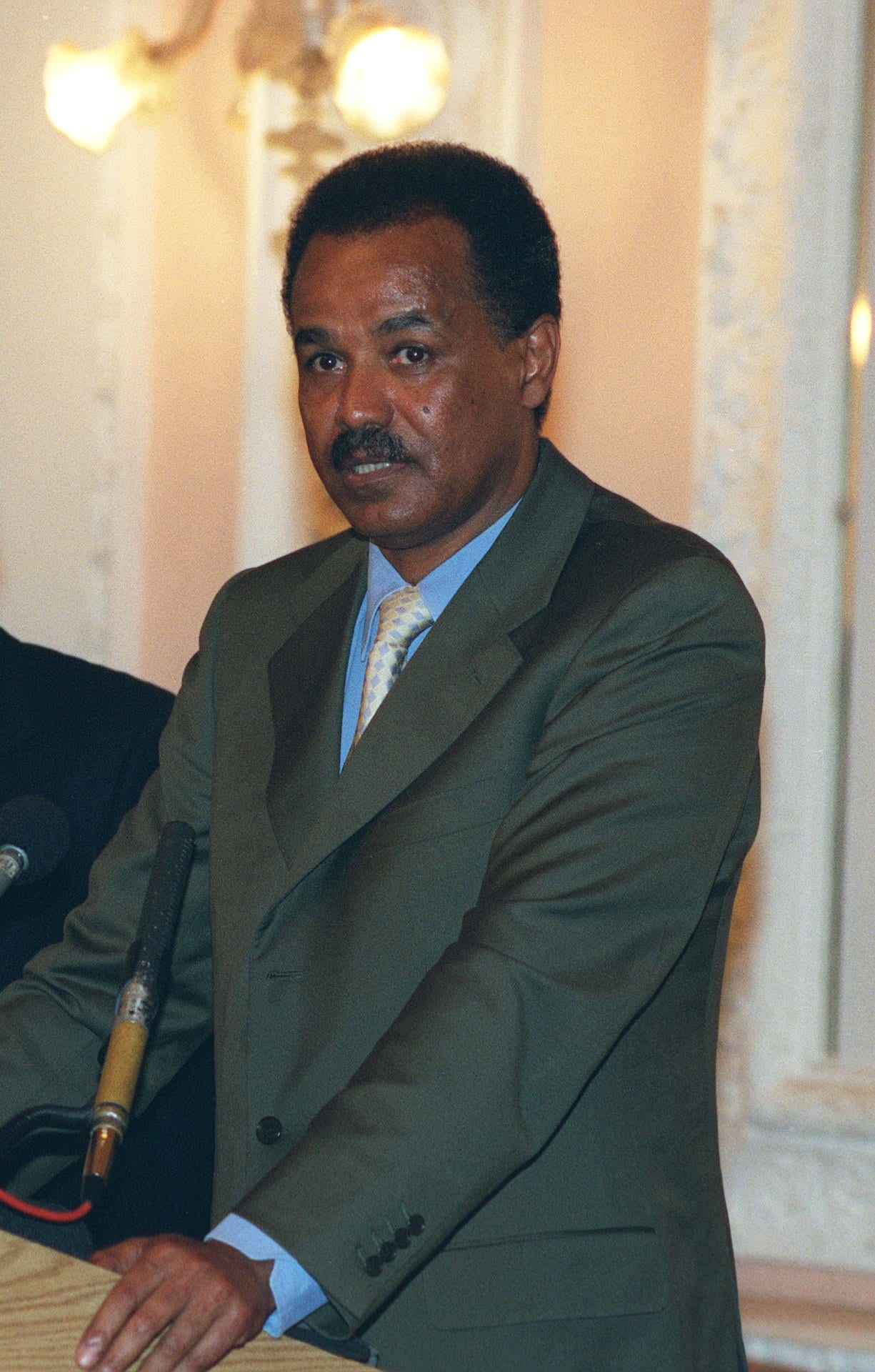 Isaias Afwerki in a suit, photographed at an official meeting in 2002