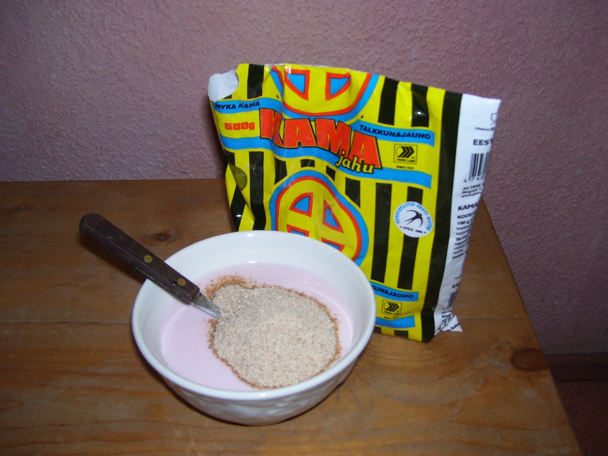 A bowl of pale, coarse roasted grain flour