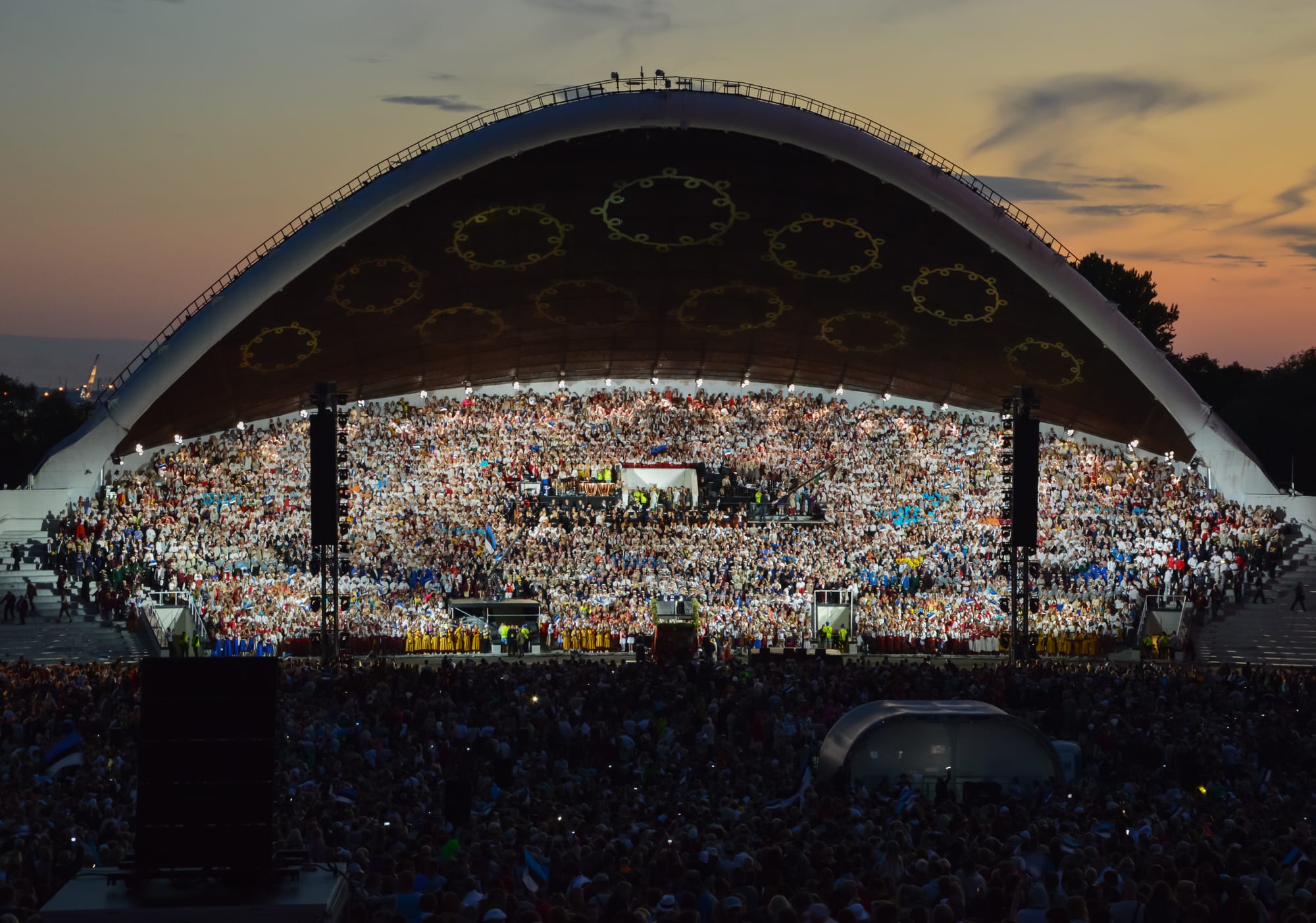 Tens of thousands of singers in folk costume massed on the tiered Tallinn Song Festival stage