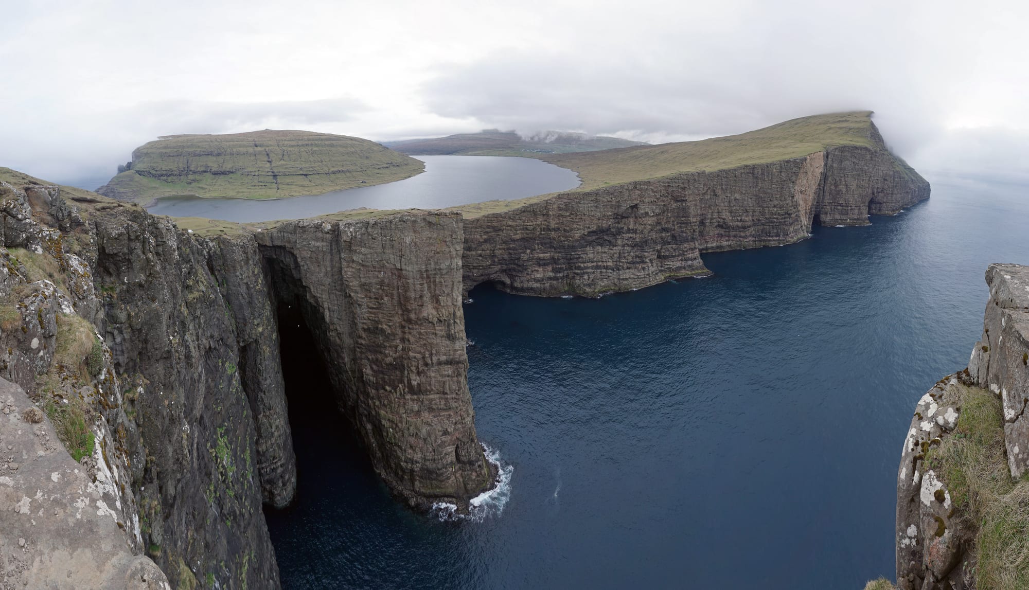A large lake apparently perched on cliffs high above the crashing ocean, an optical illusion of perspective