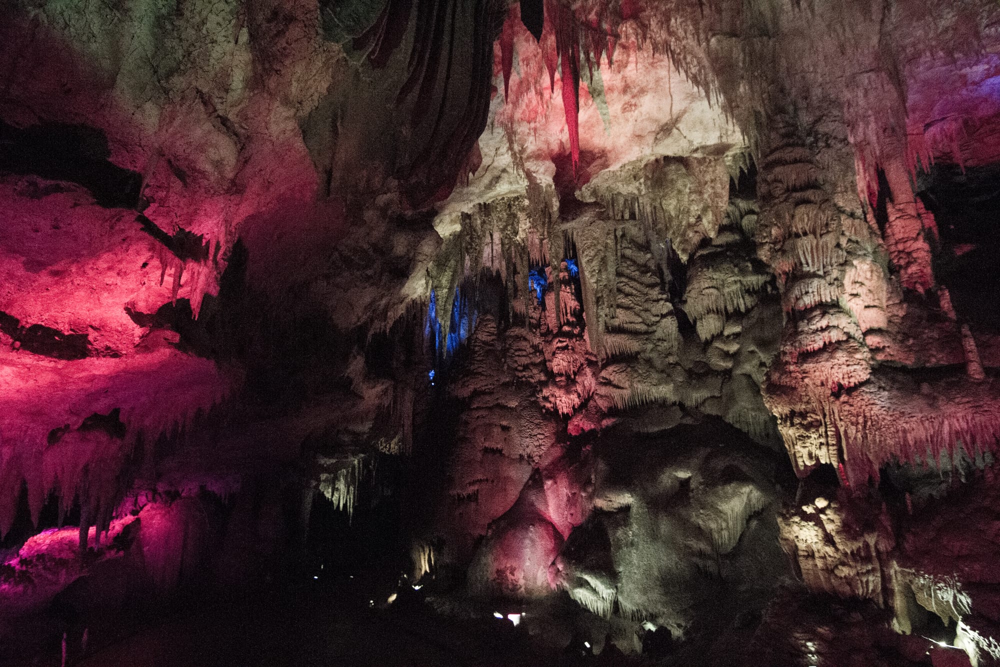 Illuminated stalactites and flowstone in a large show cave