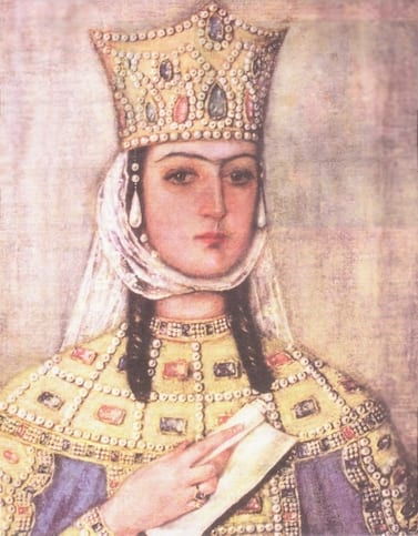 A medieval fresco of Queen Tamar wearing a crown and holding a model of a church