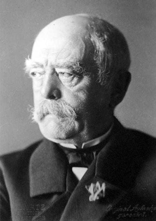A portrait of Otto von Bismarck in uniform with a stern expression