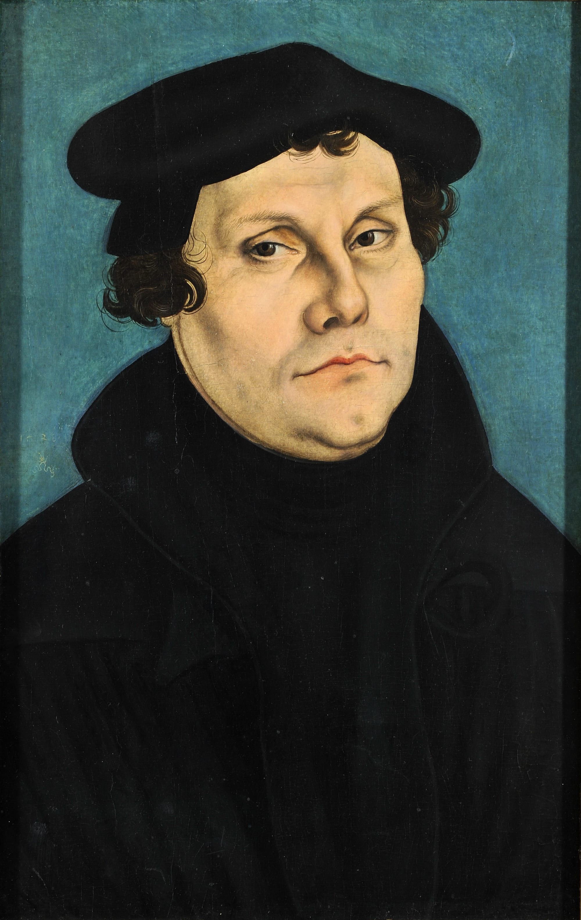 A Renaissance portrait of Martin Luther in a dark scholar's gown