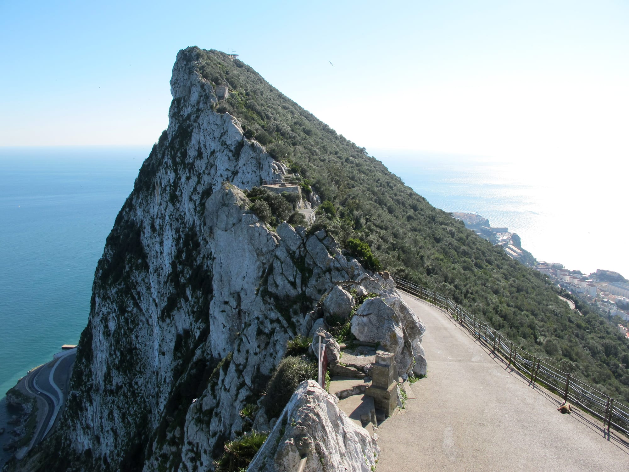 A steep limestone ridge with a cliffside path high above the Mediterranean
