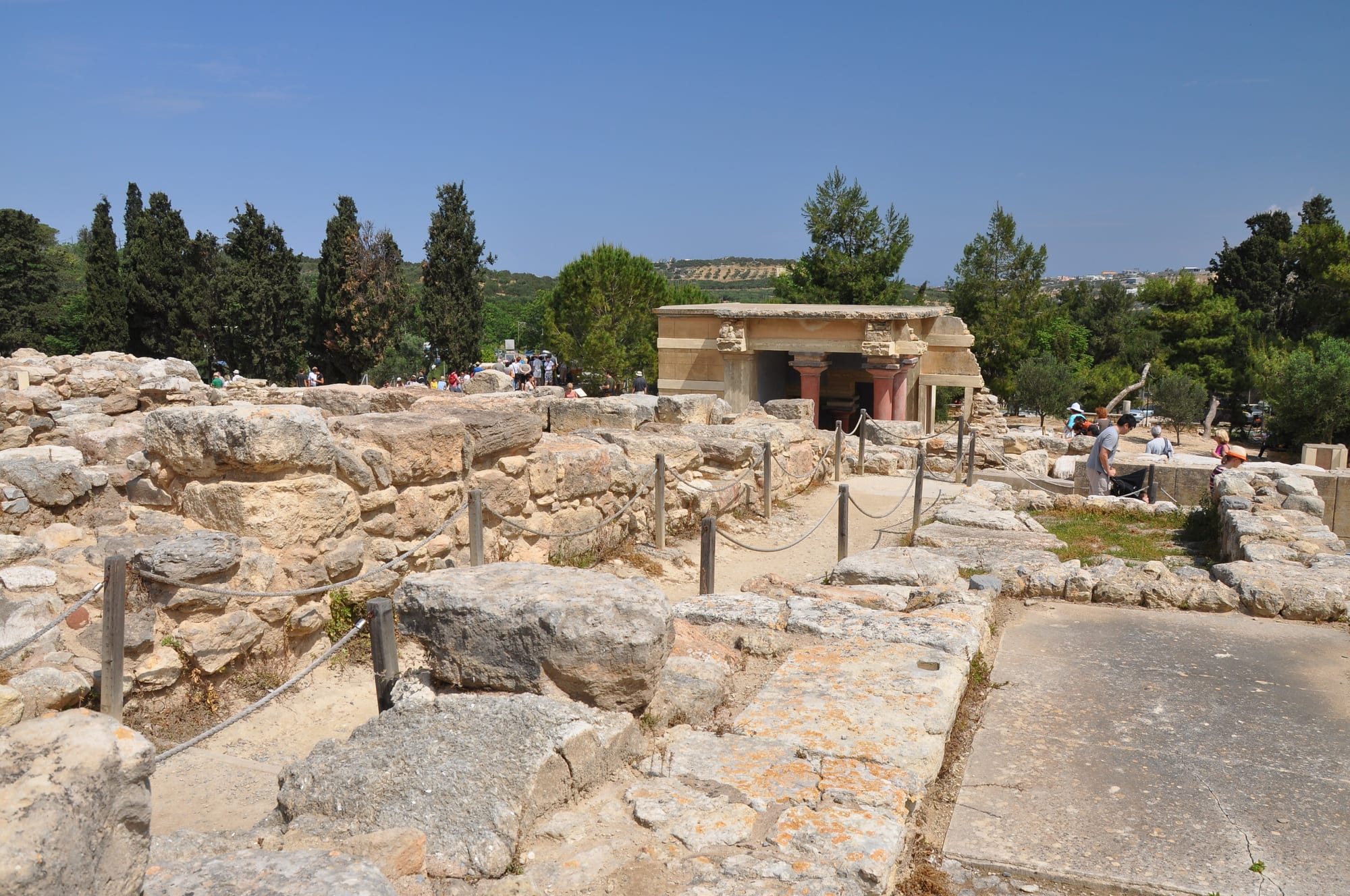 Reconstructed red columns and terraces of a Bronze Age palace complex
