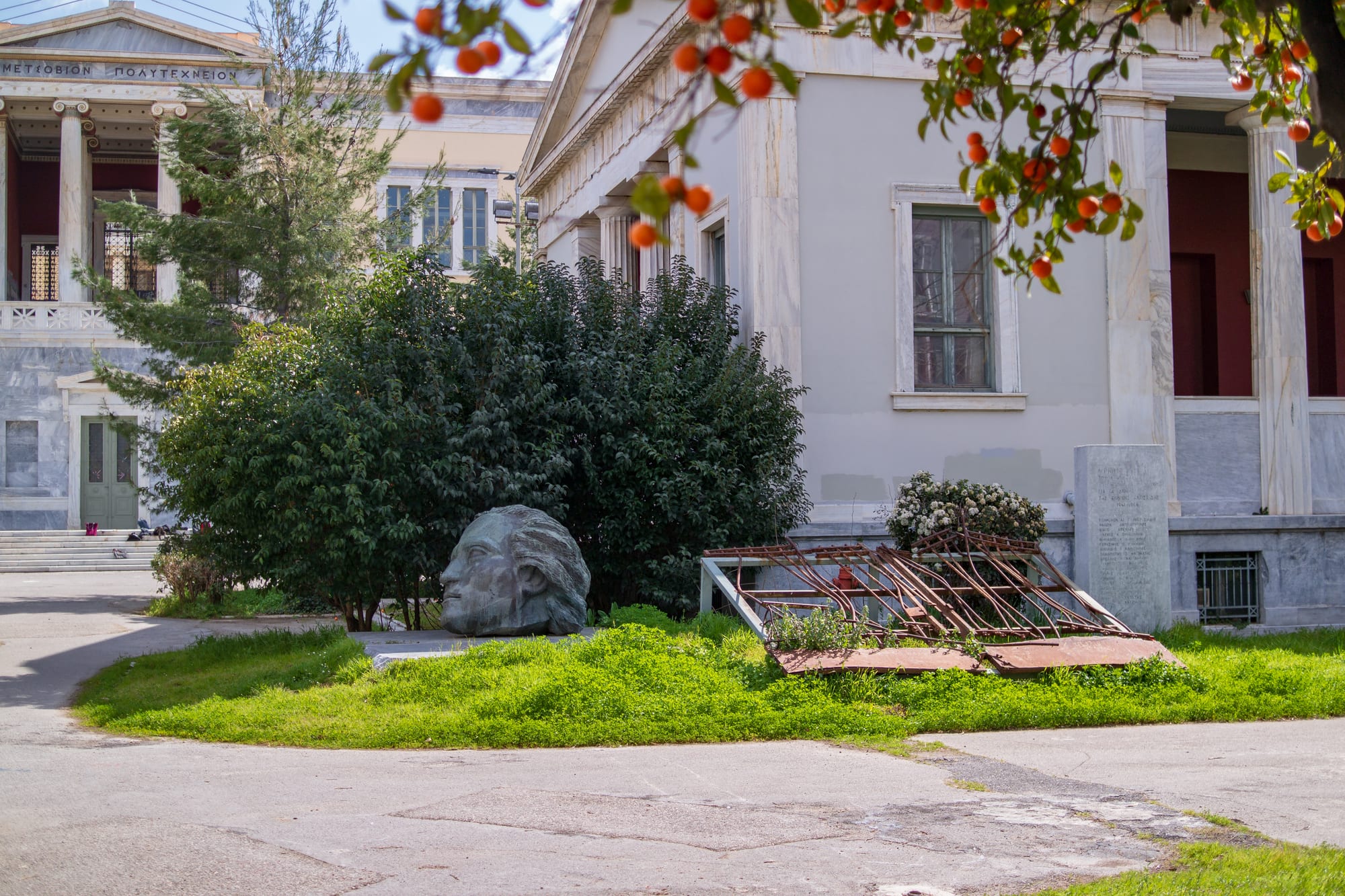 A bronze memorial sculpture of fallen figures at the Athens Polytechnic