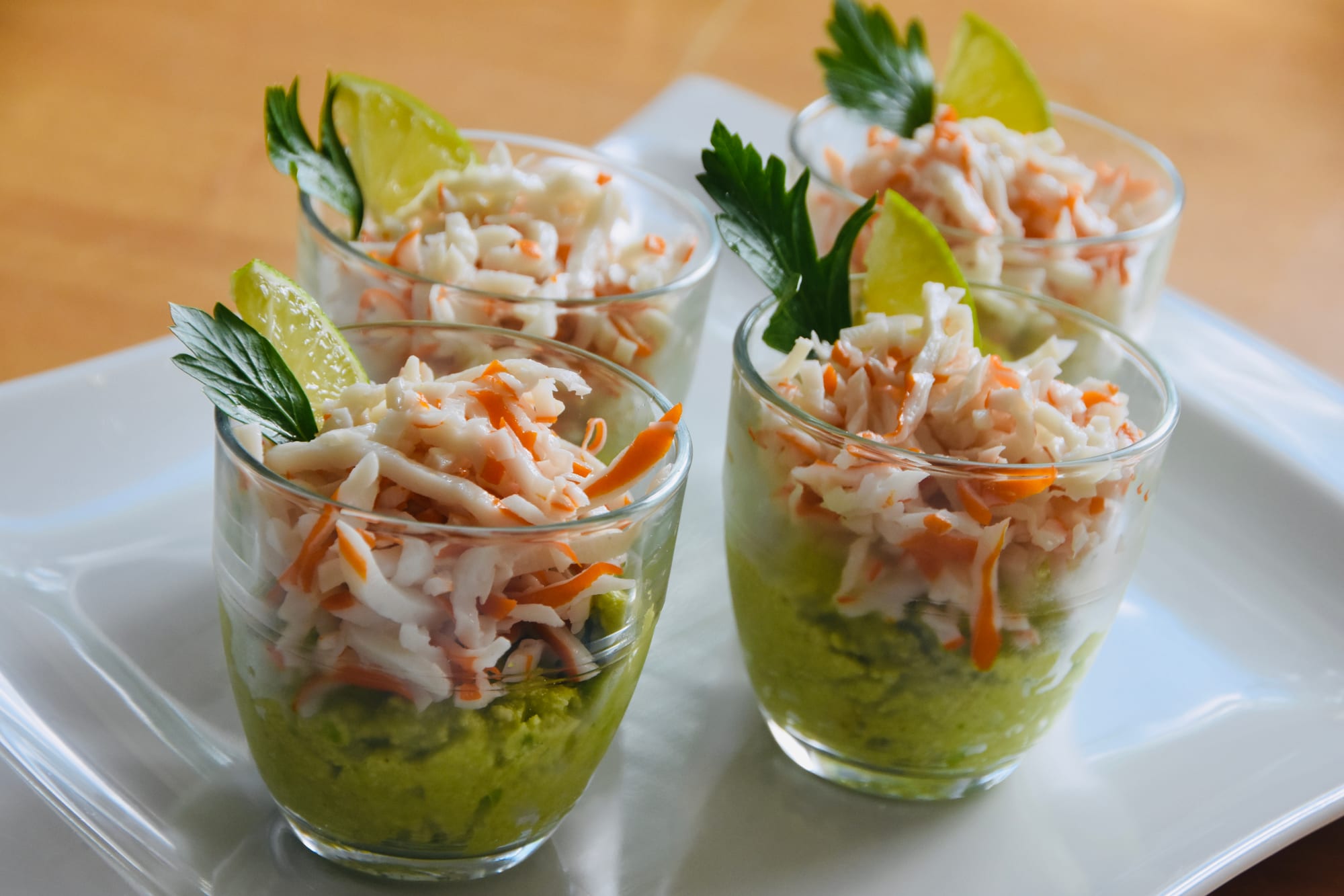 A layered dish of mashed avocado, cassava flour and seafood
