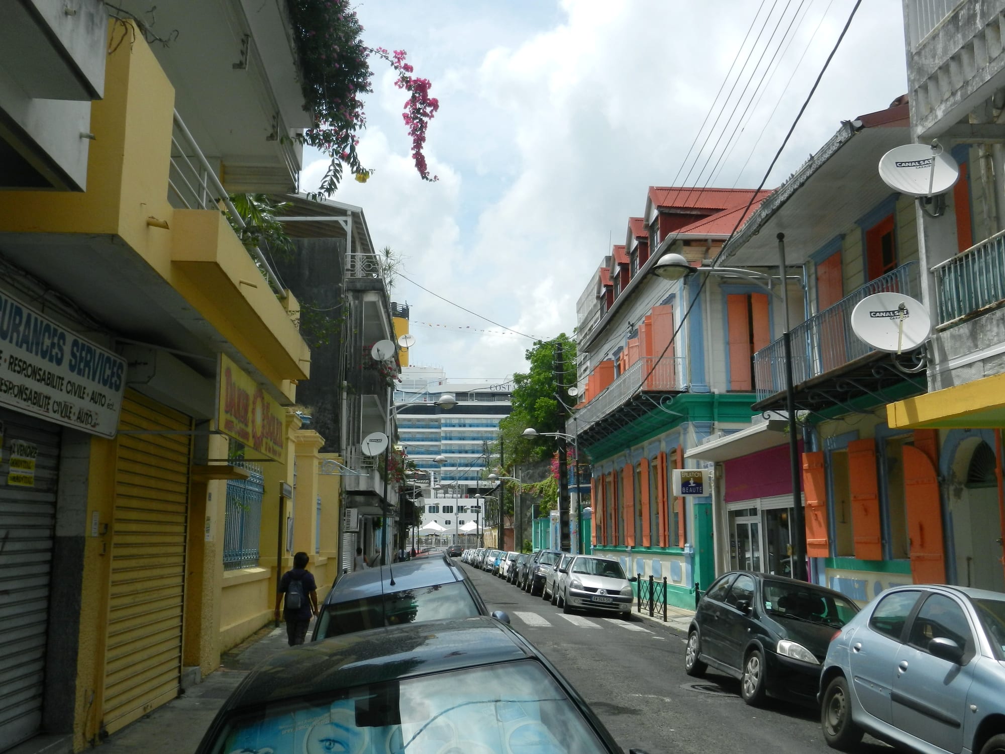 A cruise ship docked beside the port and city of Pointe-à-Pitre