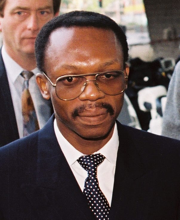 Jean-Bertrand Aristide in a suit and glasses, 1991