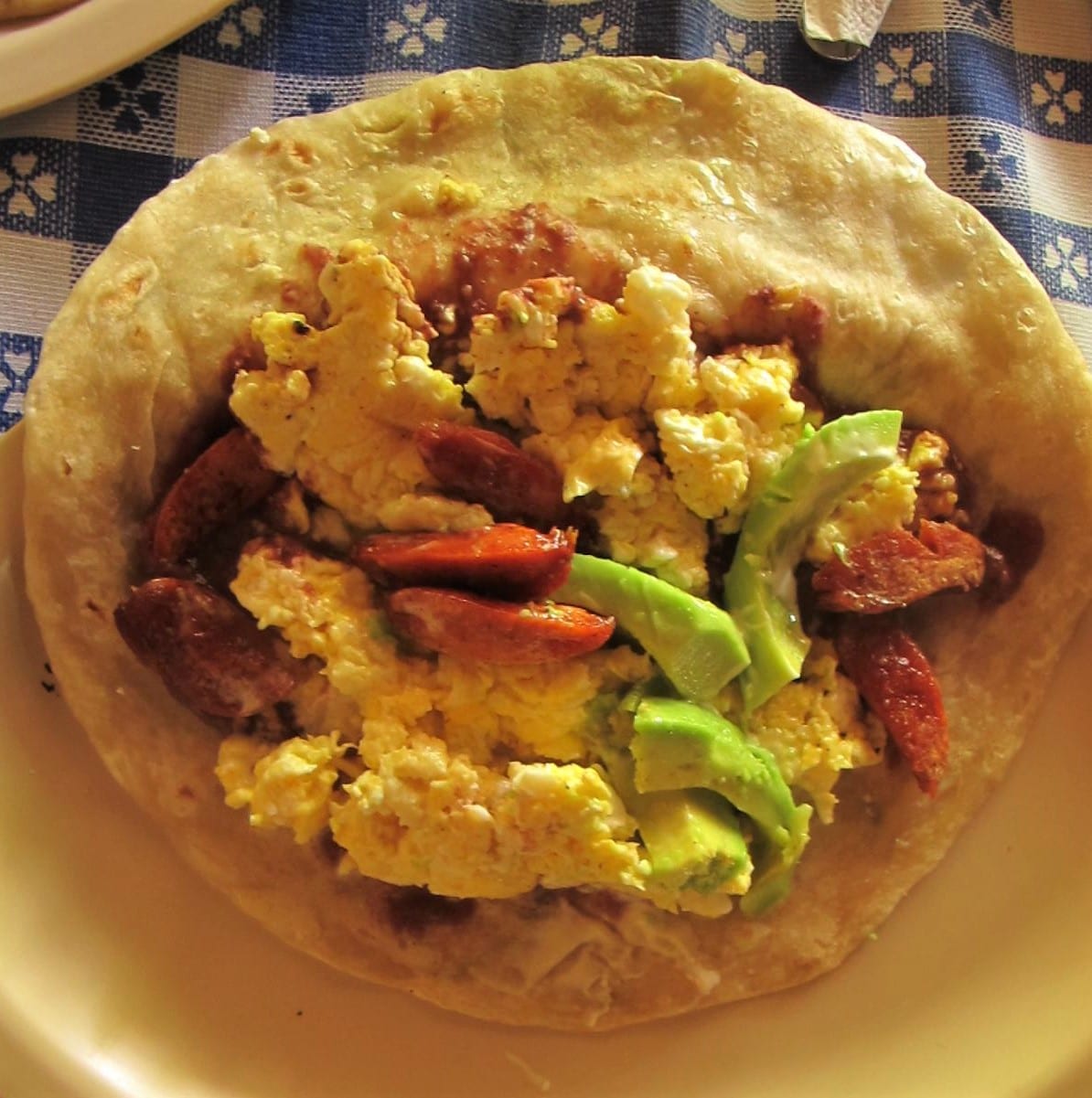 A folded flour tortilla filled with beans and cheese