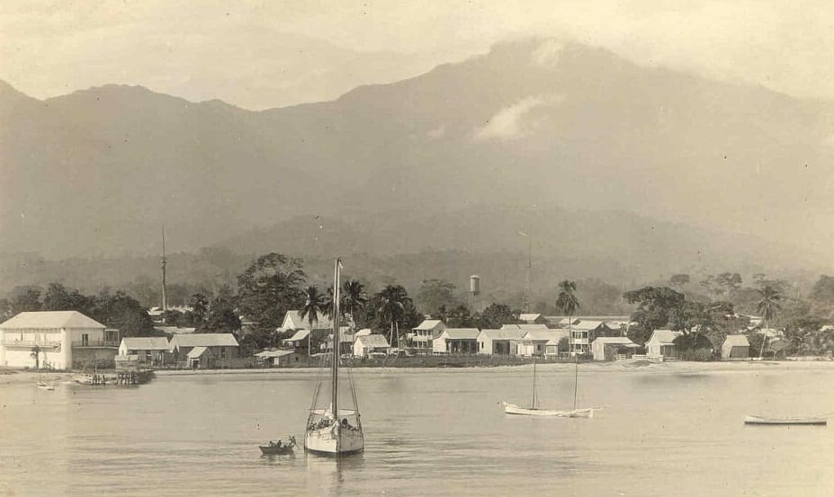 A 1910s postcard view of the La Ceiba waterfront with a pier and low buildings