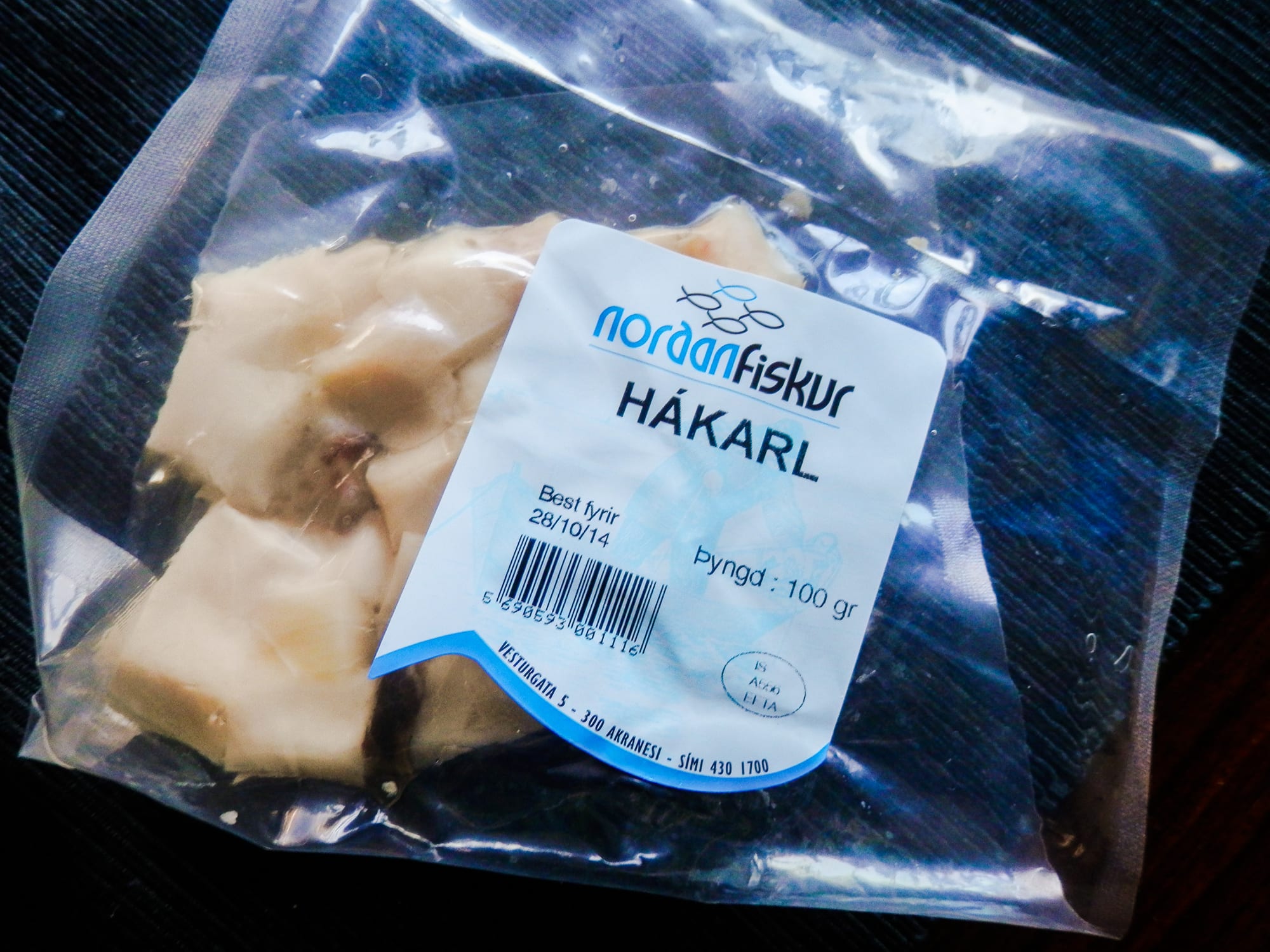 Small cubes of pale, cured fish on a plate