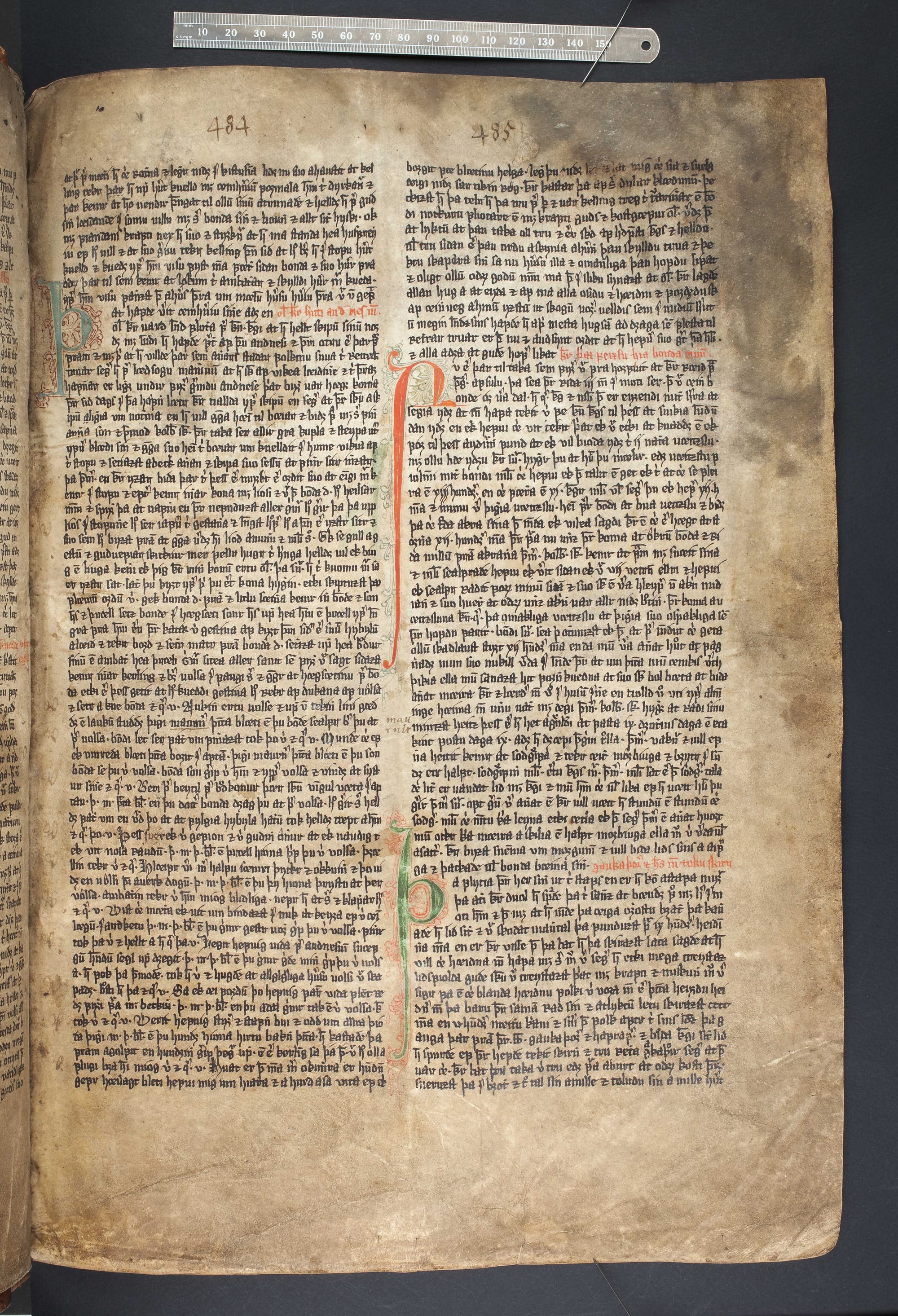 An illuminated page of a medieval Icelandic vellum manuscript with red and green initials