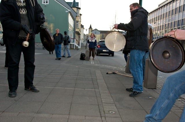 Protesters banging pots and pans outside the Icelandic parliament building in winter