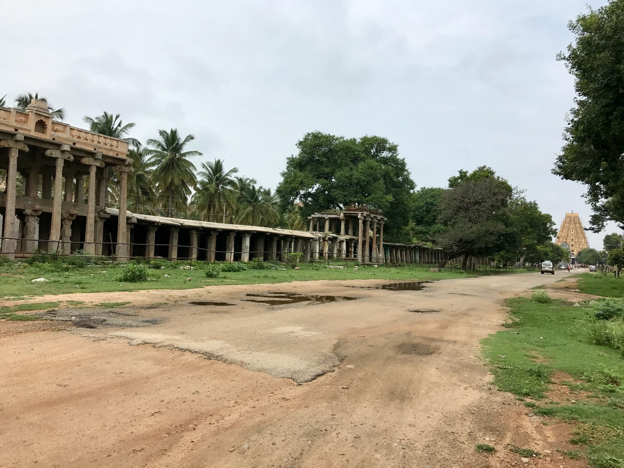 Stone temple towers and colonnaded ruins scattered among giant granite boulders