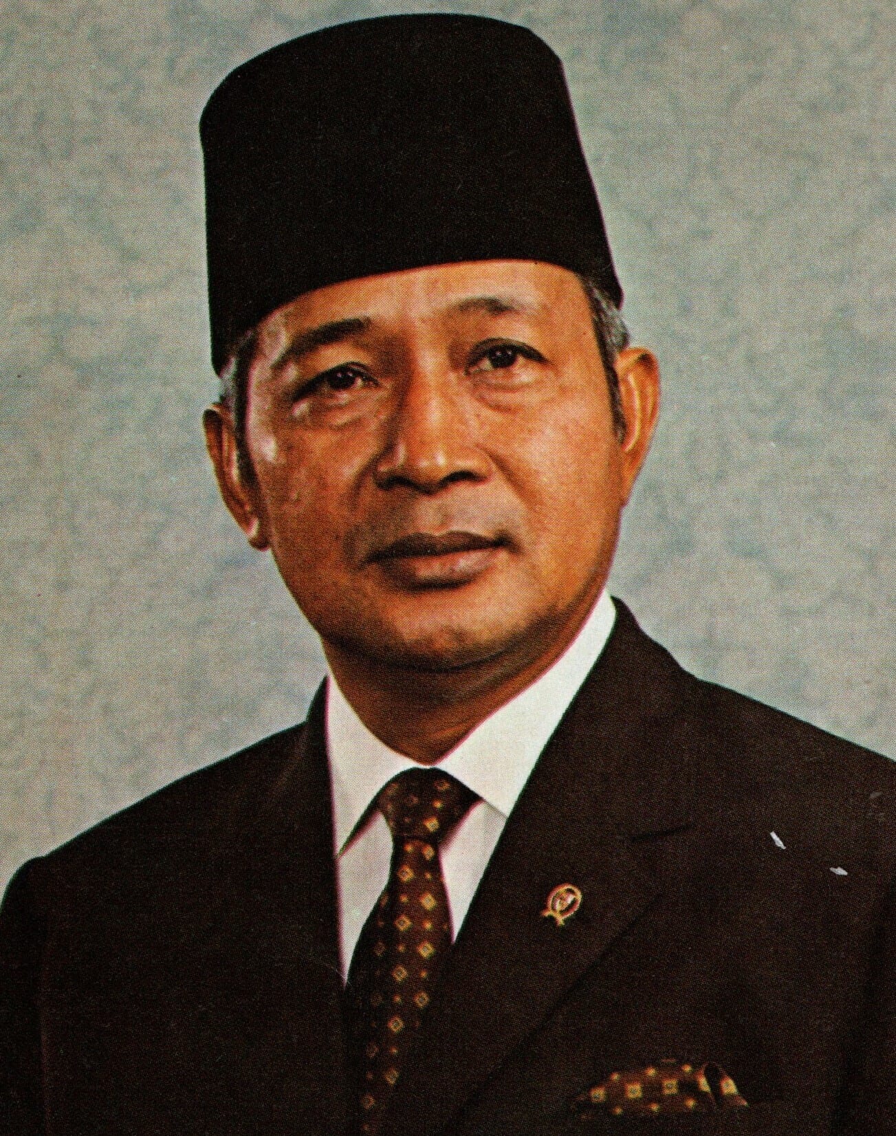 President Suharto in a dark suit and songkok cap, 1973