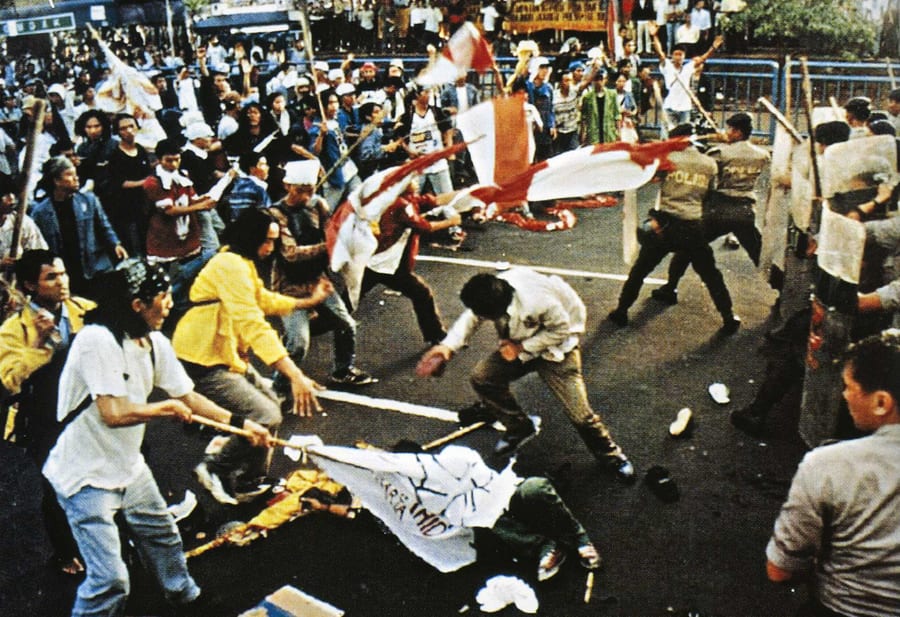 Student demonstrators and security forces on a Jakarta street during the May 1998 unrest
