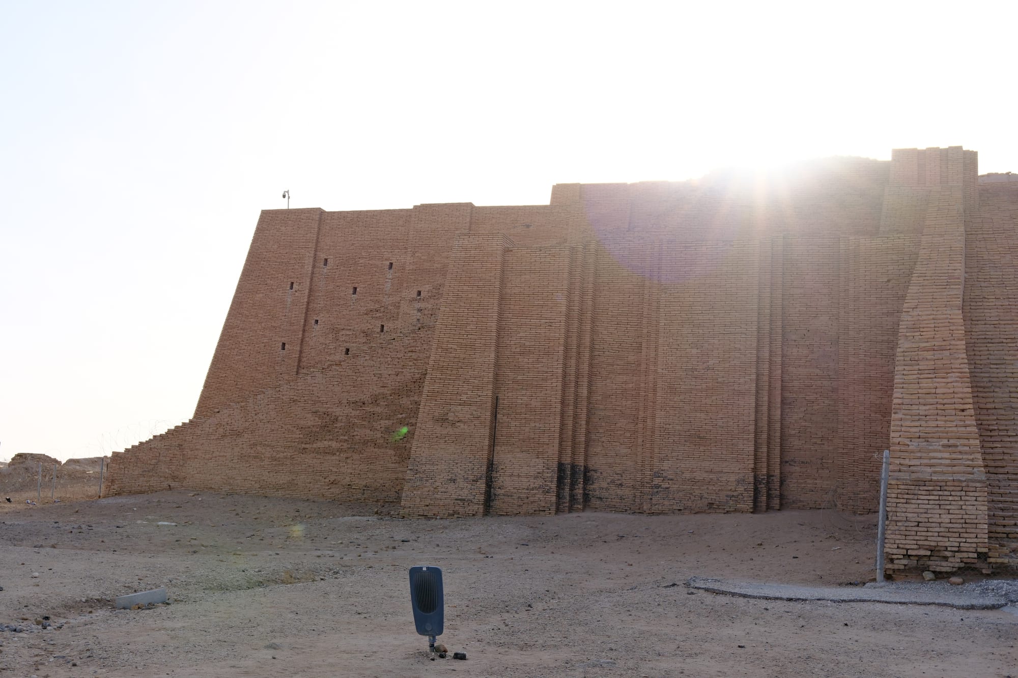 A massive restored mud-brick stepped platform with a monumental central staircase