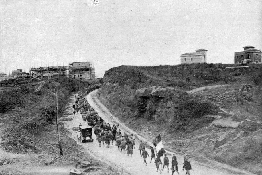 Blackshirted Fascist militiamen marching on a road toward Rome in 1922
