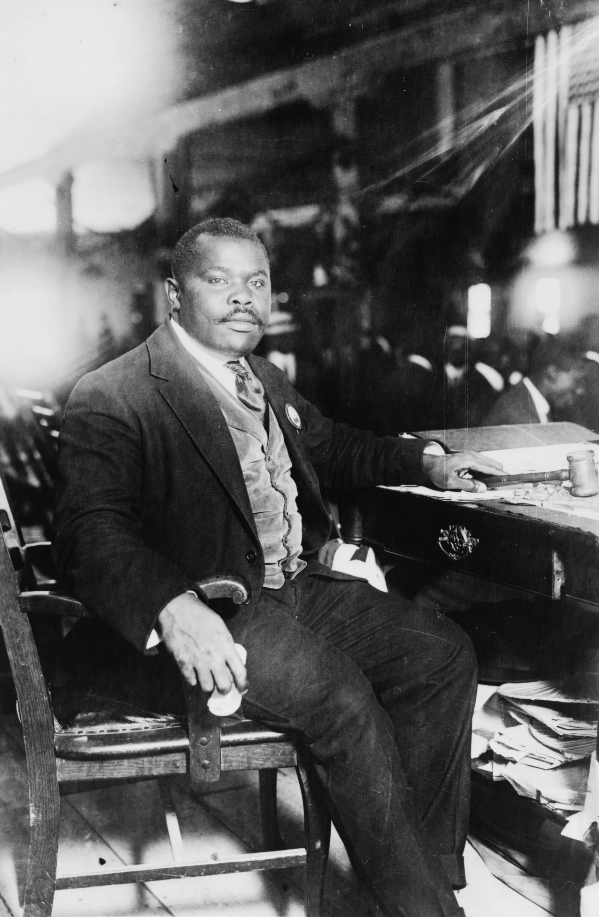 Marcus Garvey in a plumed ceremonial hat and braided uniform, 1924
