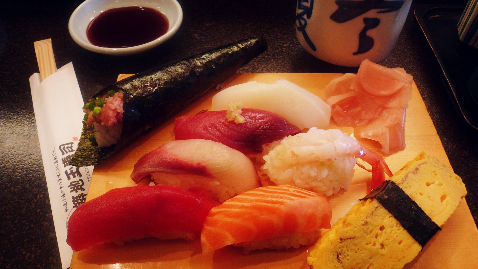 An assortment of sushi pieces topped with different types of fish and seafood