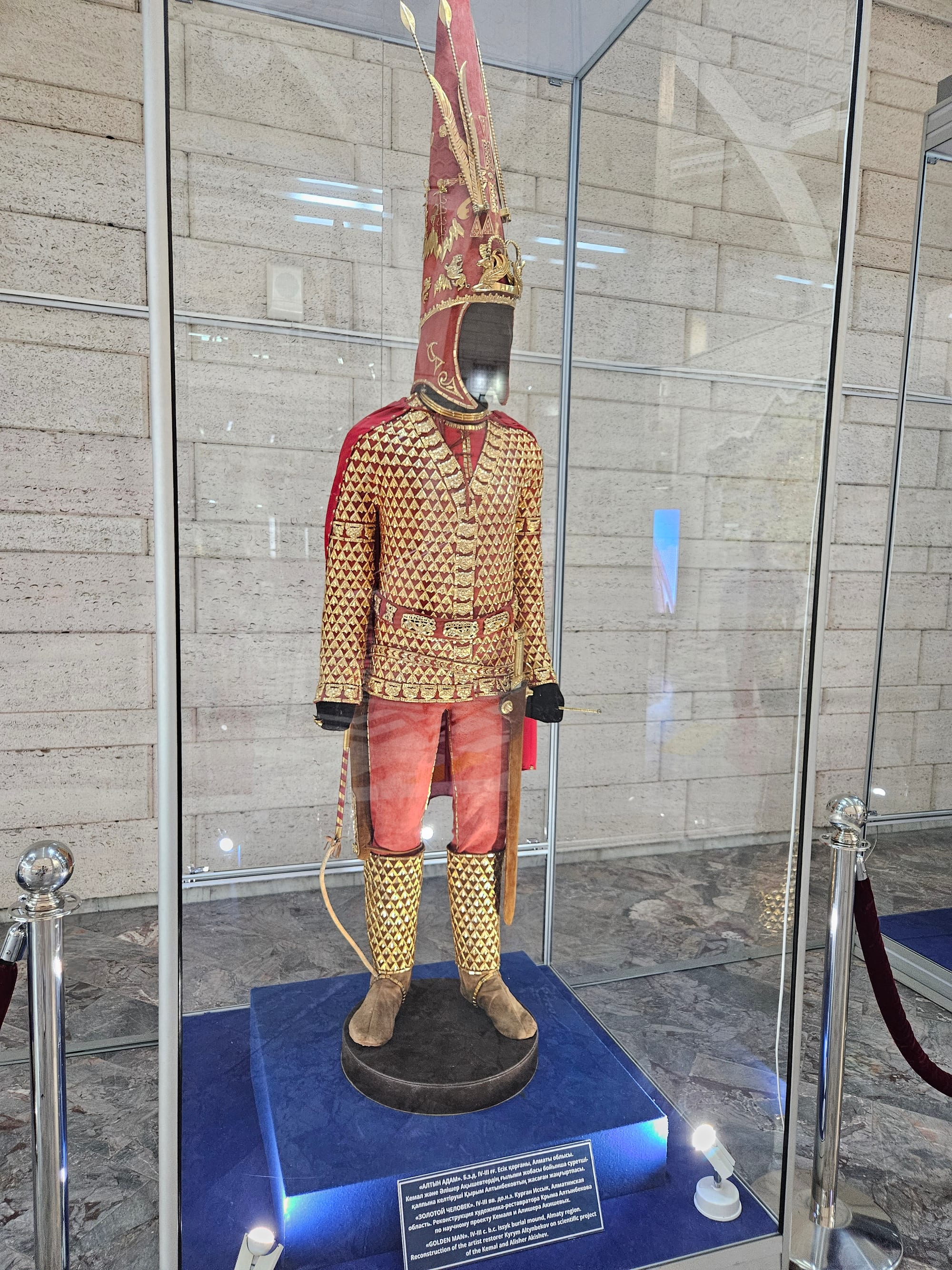 A reconstructed Saka warrior's costume covered entirely in thousands of gold ornaments