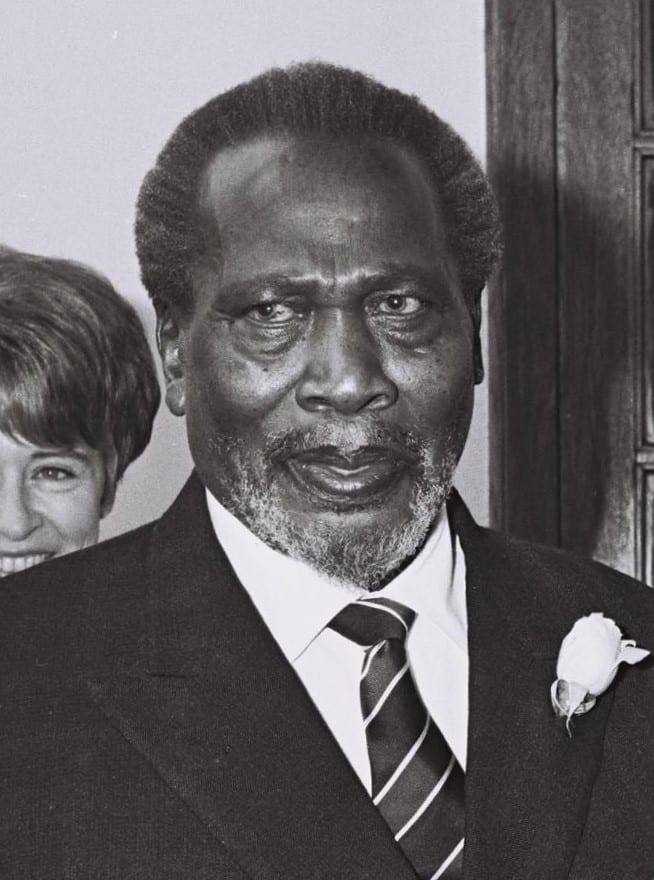 Jomo Kenyatta in a suit and beaded cap, 1966